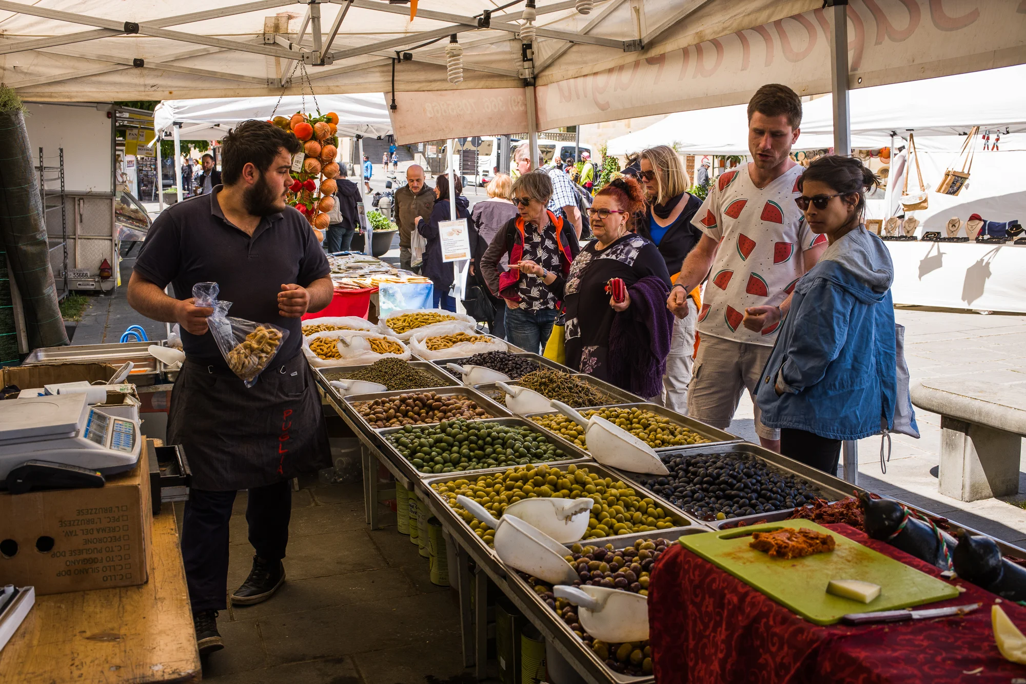 Buying olives in the market
