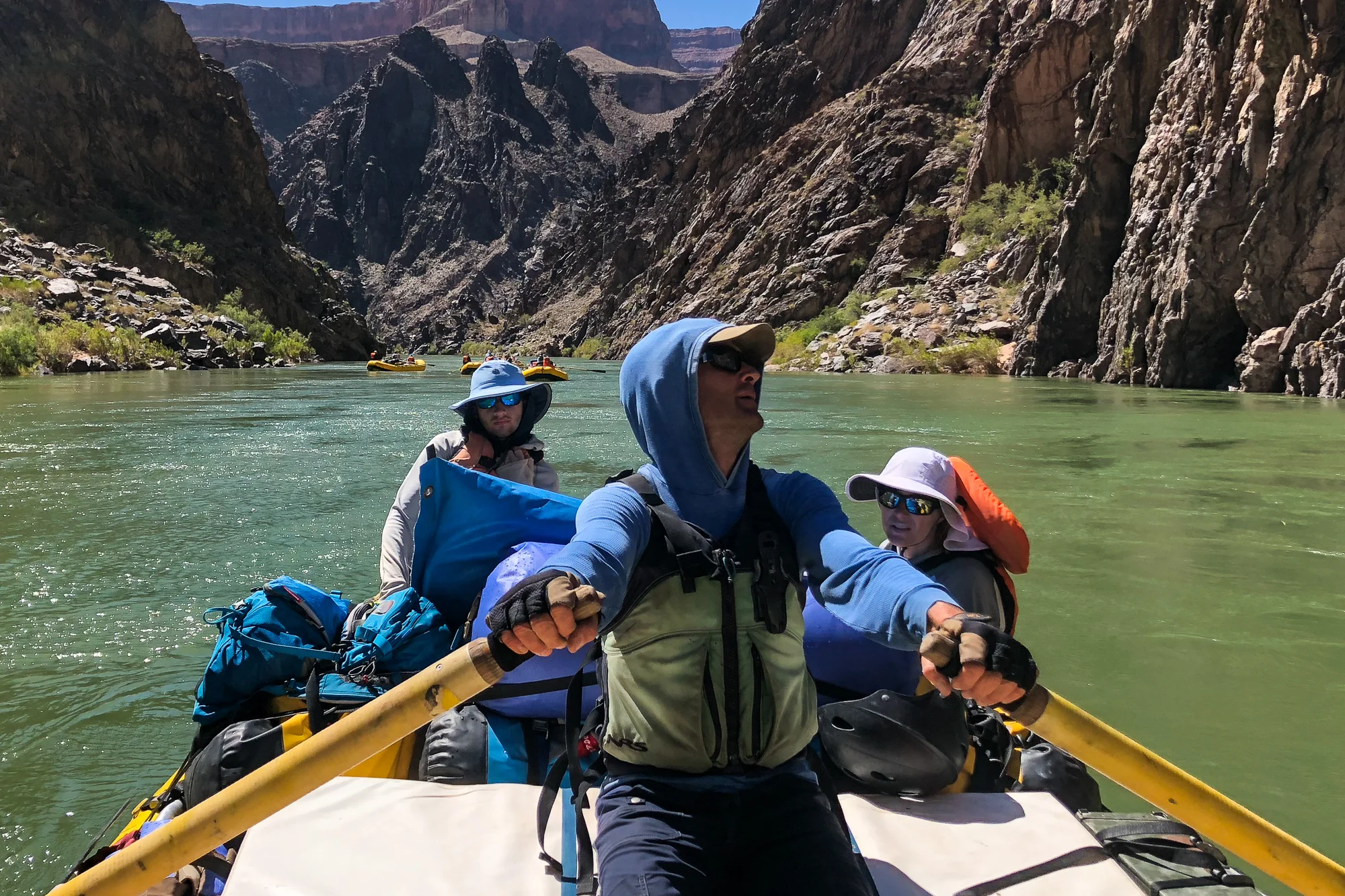Jake and Bird watch as Nathan rows through the Black Vishnu Schist and Pink Zoroaster Granite