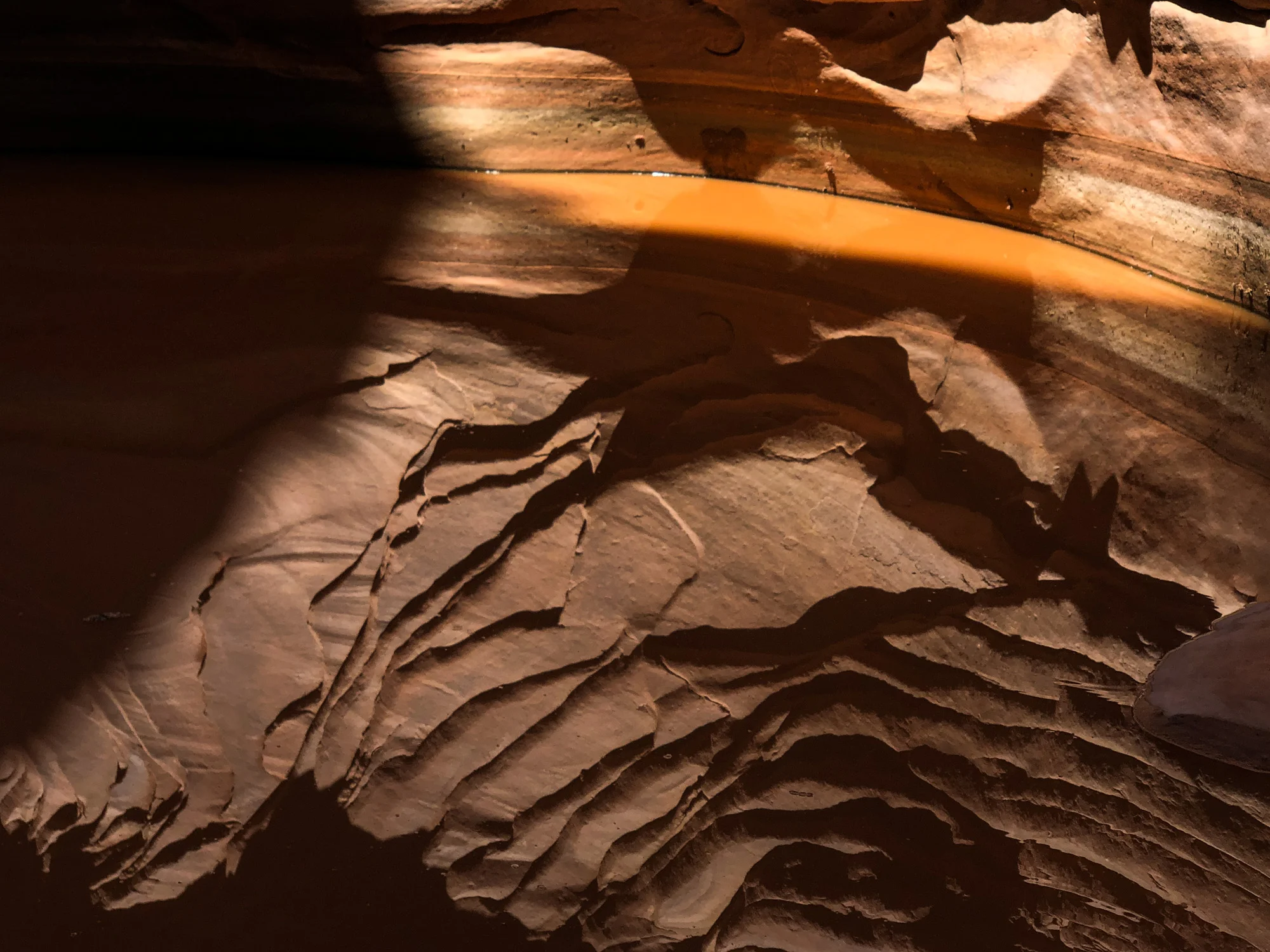 Reflection on the water in a slot canyon