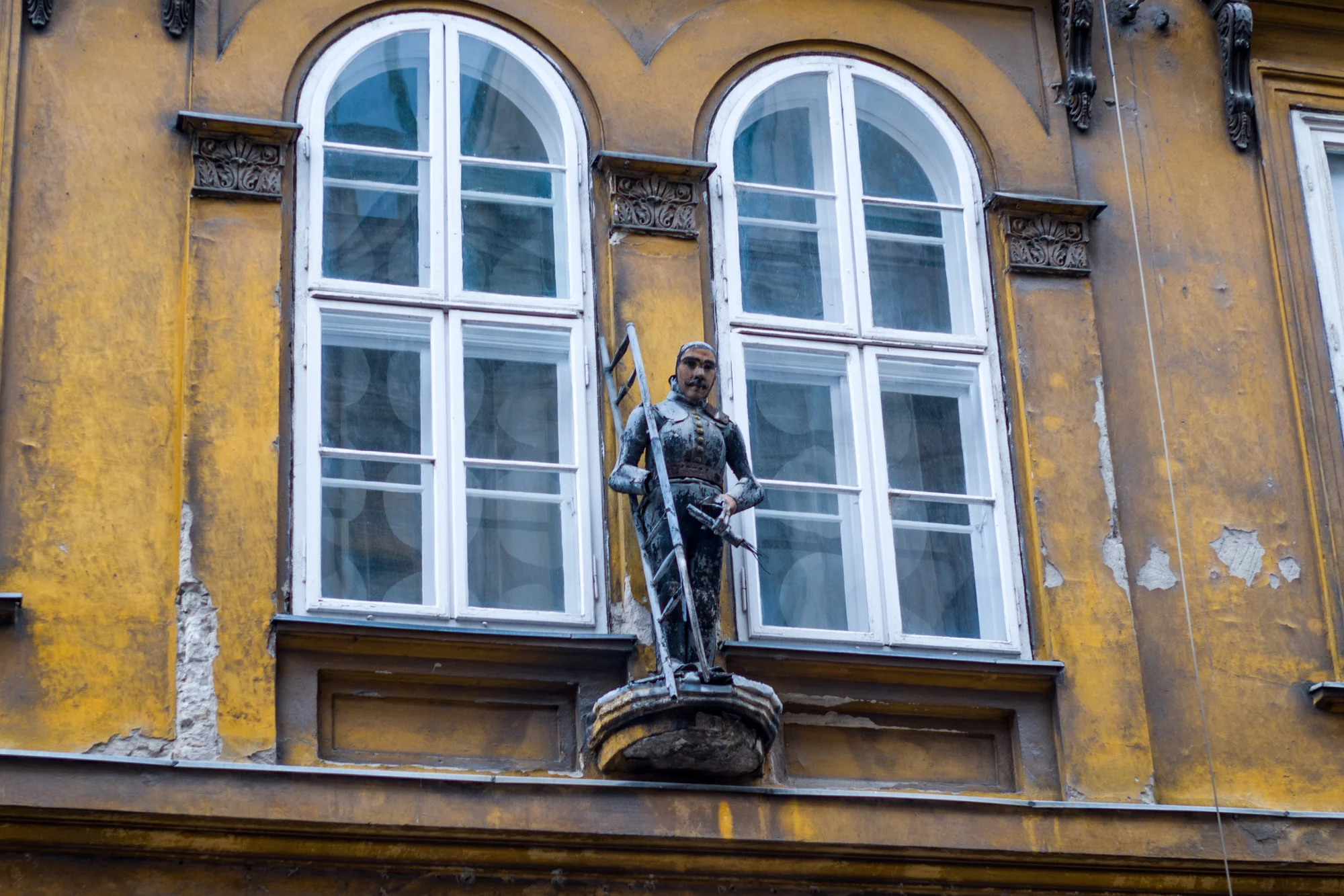 Typical Budapest architecture during the Austro-Hungarian Empire. The building was a craftsman guild house. The grandness of the time is apparent as well as the decay from the tragedies of the 20th century.