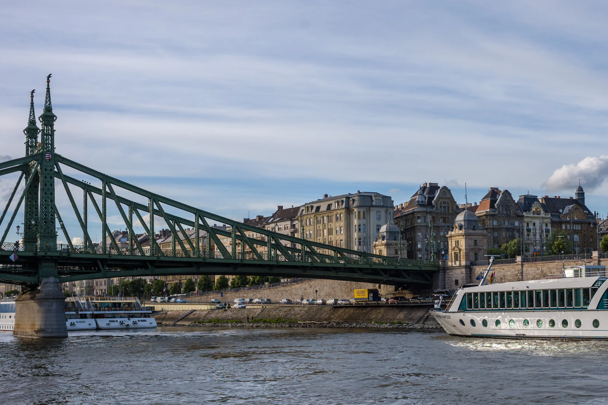 Cruising under a bridge floating on the Blue Danube