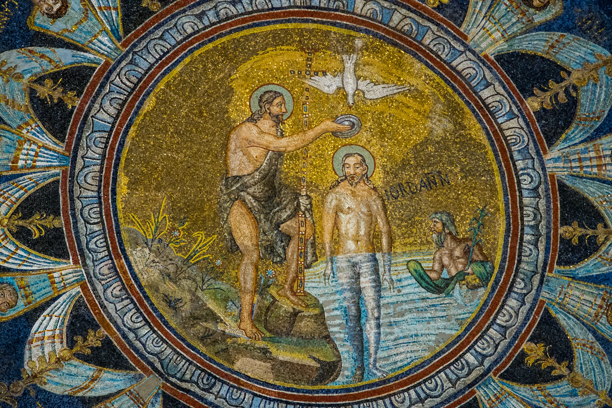 The baptism of Christ at the top of the baptistry