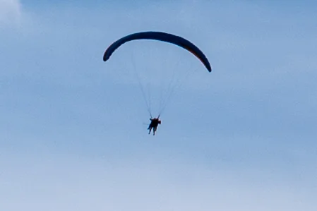 M10, 35mm Summilux. Cropped very tightly. 450x300 pixels. Notice you can see the ropes of the glider.