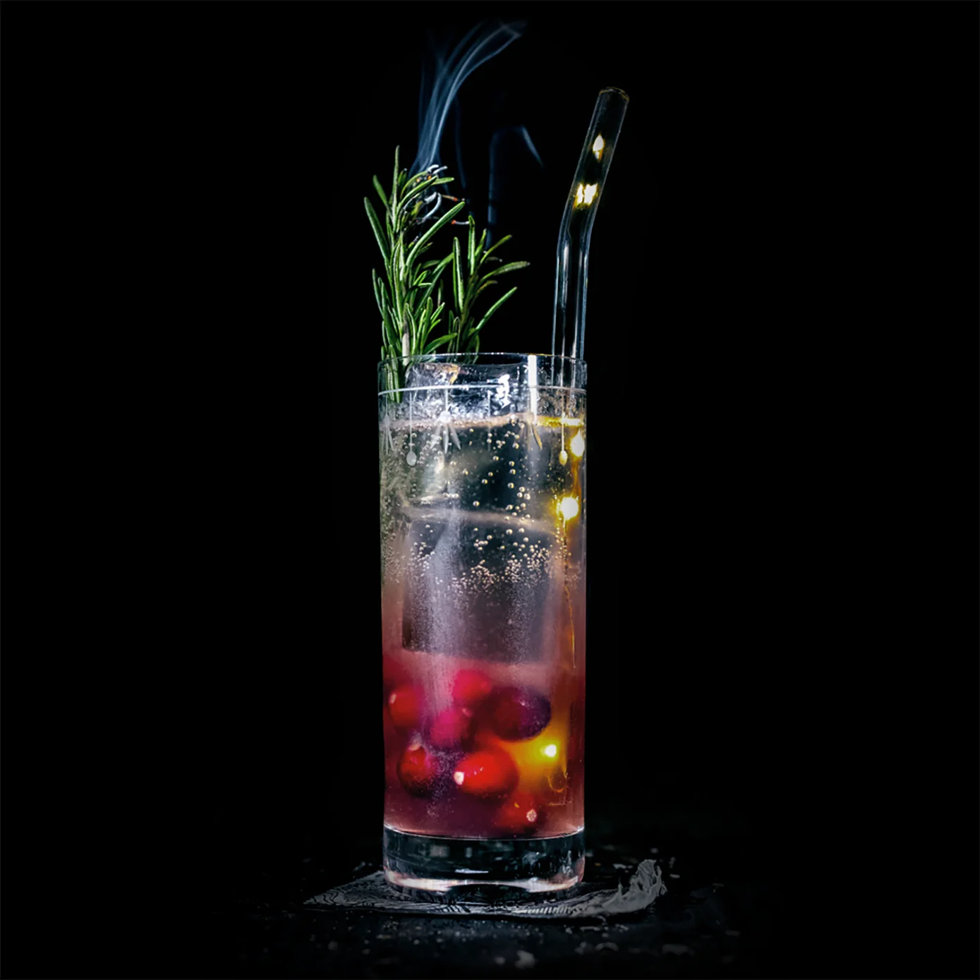 HOLIDAY IN OAXACA INGREDIENTS - 1.5 oz. Espadin - 1 oz. Cranberry Syrup (1 part unsweetened Cranberry Juice to 1 part sugar) - .5 oz. Fresh Lime Juice METHOD Shake and strain into a collins glass. Top off with soda water and garnish with a rosemary sprig.
