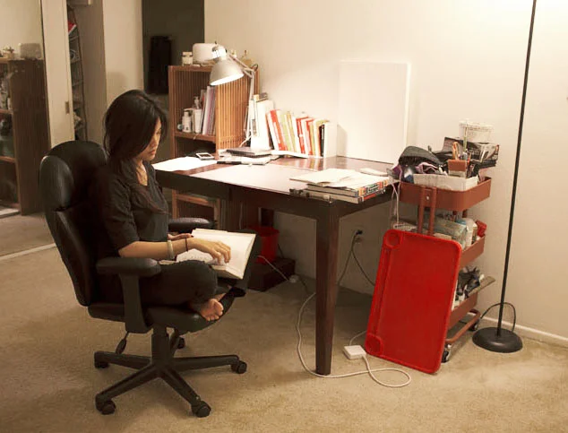 Lily Mendoza researching design at her desk