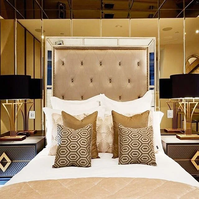This bedroom oozes art deco glamour - the antiqued mirror wall was a challenge to work with but we decided on this fabulous mirrored headboard which was a bold move but complimented the feature wall - we then styled with these ‘Yves’ #tab