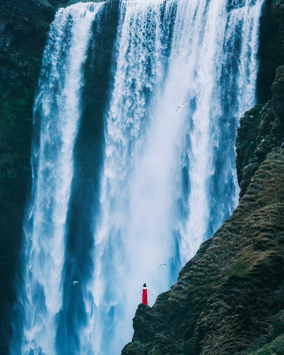 Iceland Skogafoss with emily in a red dress by MichaelMatti.jpg