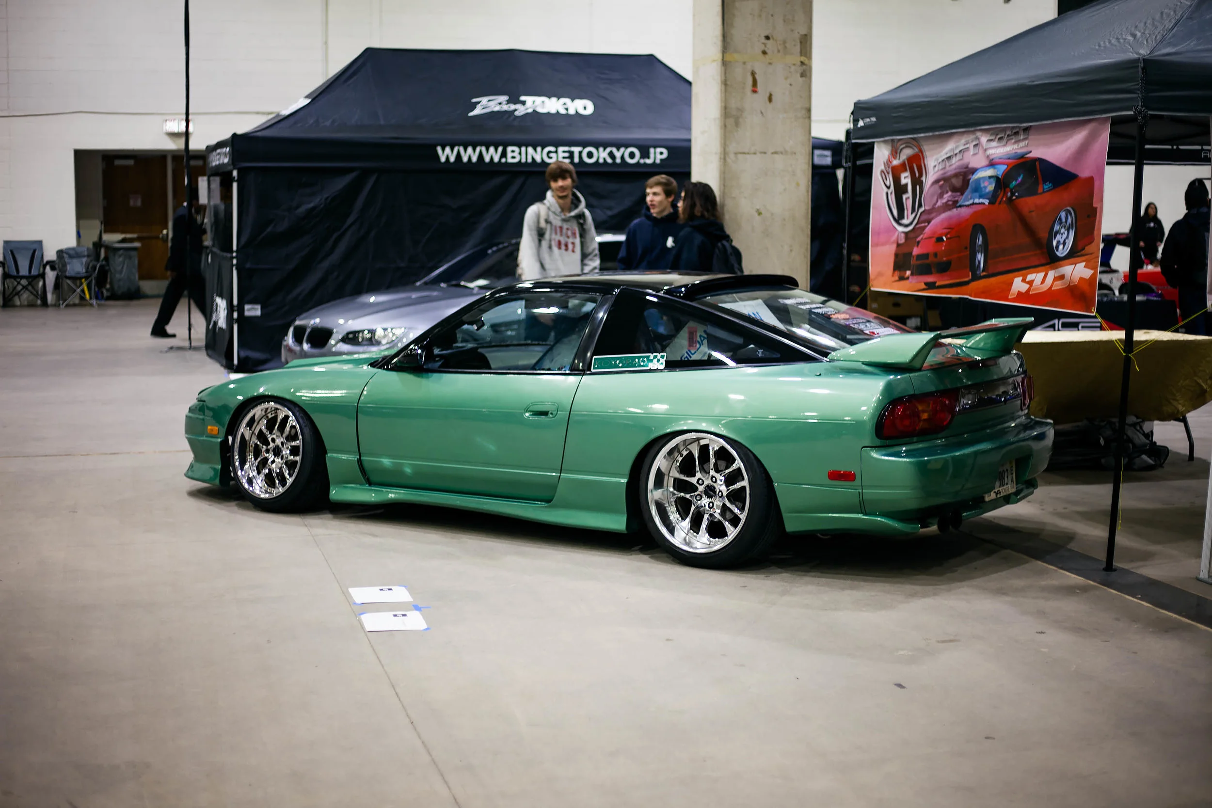 Melvin's 240sx decked out in a Midori Green on SSRs and 180sx aero. Sitting low and setup for drifting, but still breaking necks at a car show. Glad to see the ClubFR guys setup promoting another style of driving. If you're in the midwest region and are trying to get into drifting, you definitely need to attend one of their drift days. Simba and crew are arguably the best OG drift dudes in the USA.