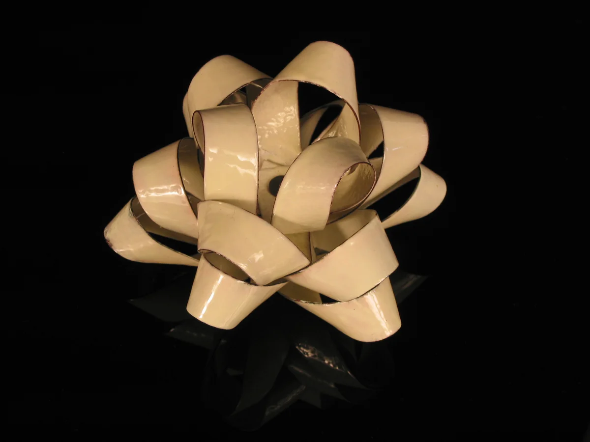 White Bow. enameled copper, 7" diameter
