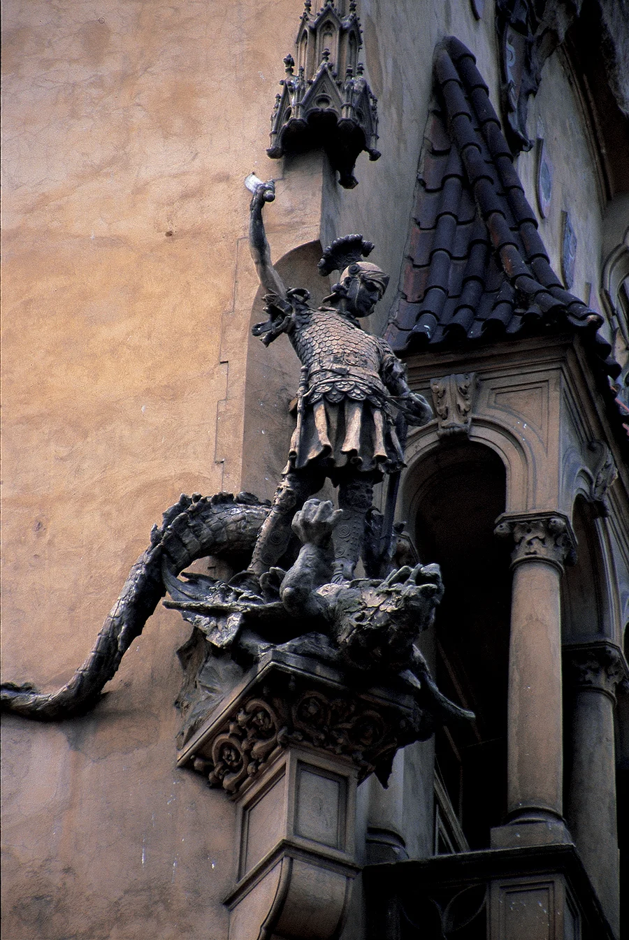 St. George slaying the dragon. In Christianity, the serpent is often associated with the Devil, and the religion promoted the symbolism of saviour-versus-serpent. (Welsh folklore contains some notable exceptions to this view). Photo: Prague, Czech Republic