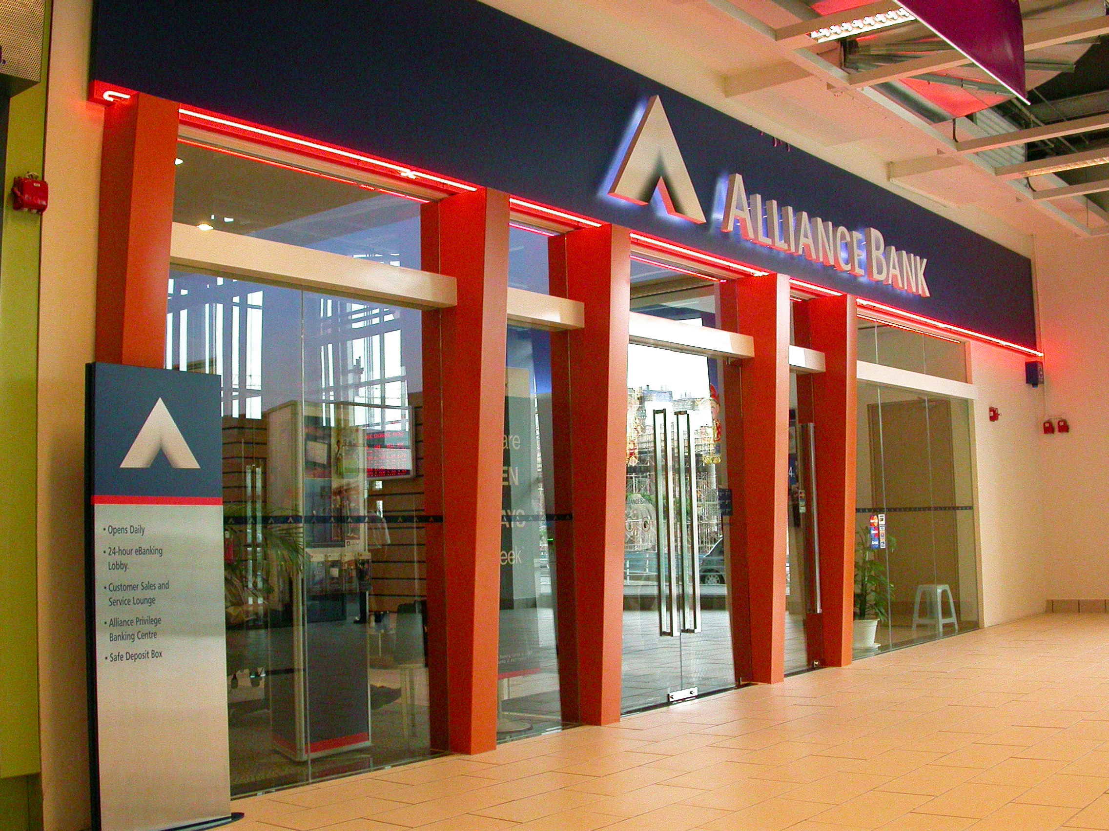 All offices and retail branches of the seven financial institutions throughout the country had to undergo a quick overhaul, and the easiest and most economical means of establishing its new identity across all physical locations was to paint some part of the fa ç ade in the bank’s signature red.