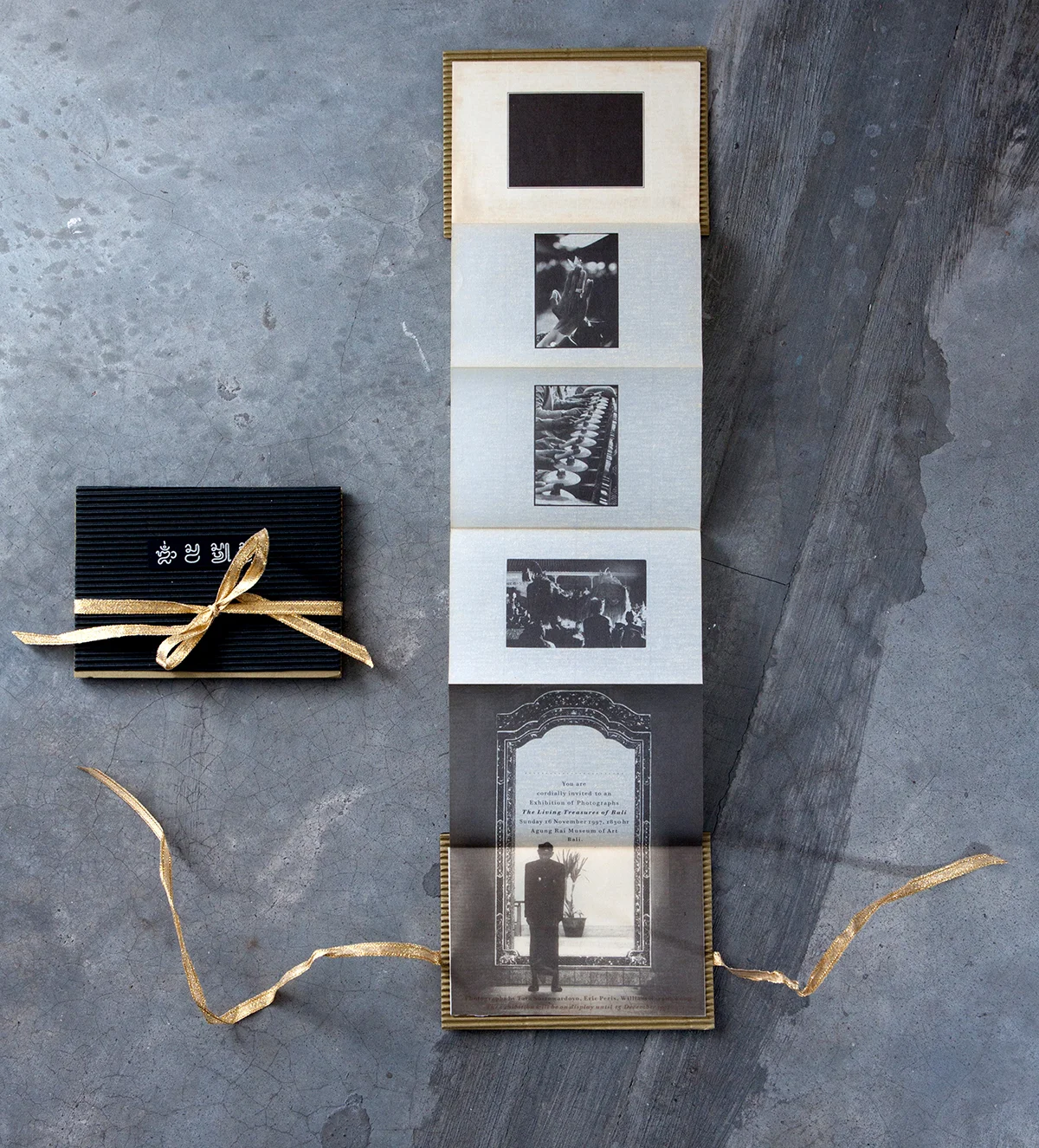 Invitation card designed by William Harald-Wong. Printed on tracing paper attached to two corrugated boards glued back-to-back, one in black and the other, olive green.