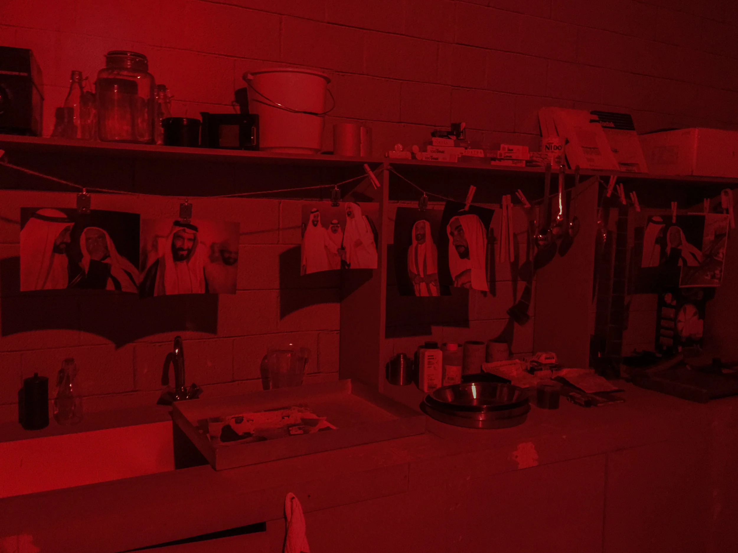 The mock-up darkroom. What's missing was the pungent smell of the film and print processing chemicals. We recorded the sound of prints sloshing in the chemicals, etc, and some small talk in Hindi in the background to bring life into the darkroom space.