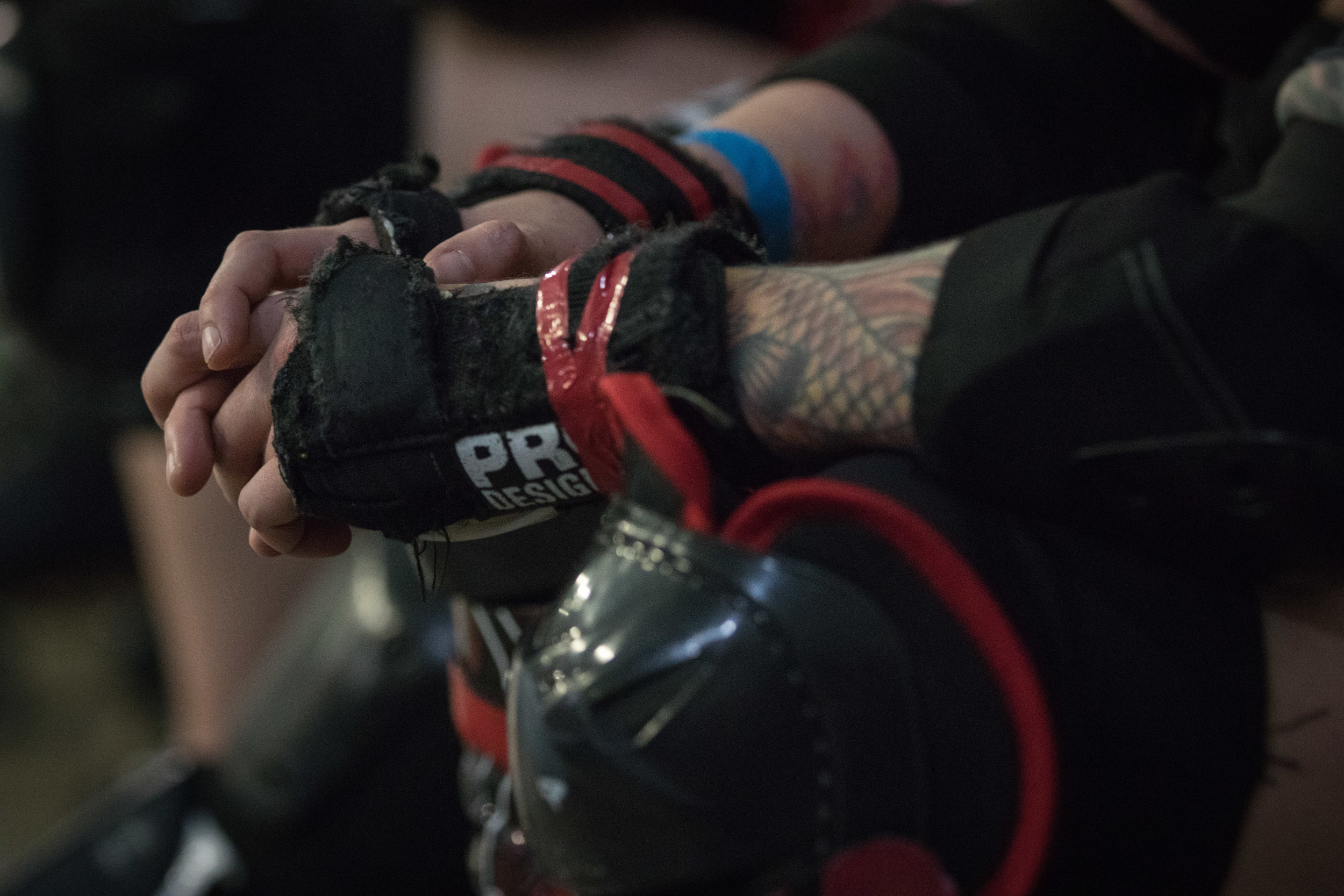 Roller derby is a brutal contact sport. Players wear helmets, mouth guards, wrist guards, and kneepads to protect themselves against injury.