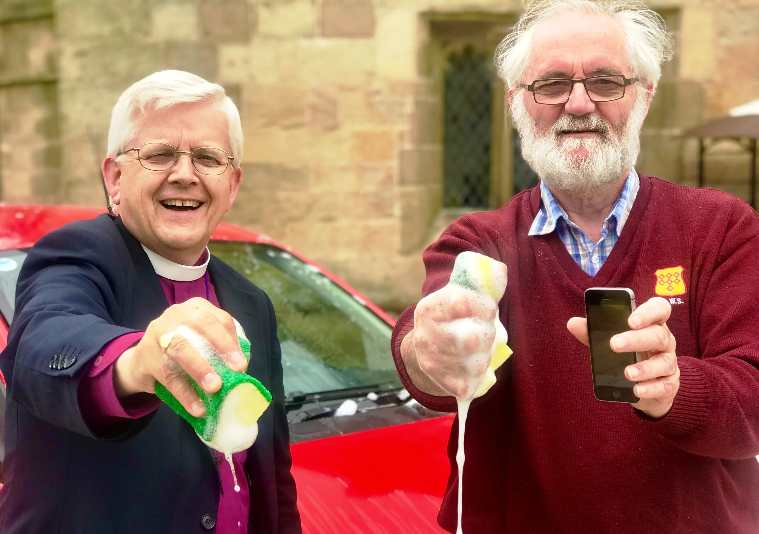 Bishop of Blackburn (L) and Rev Canon Ed Saville (R) promote the Safe Car Wash App