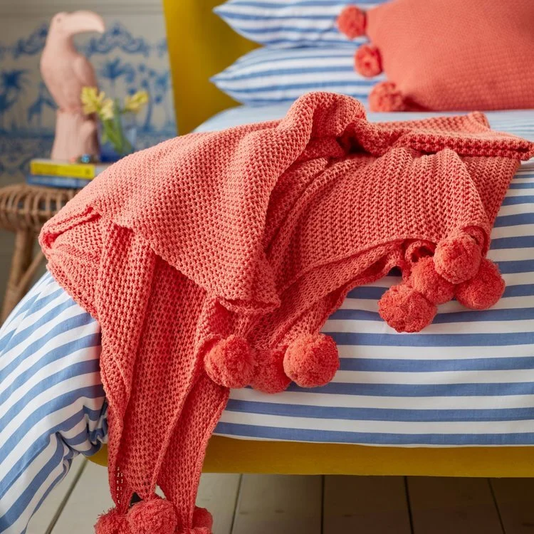 Secret-Linen-Store-Hot-Coral-pompom-throw-£95-1600x1200px-crop-1200x1200.jpg