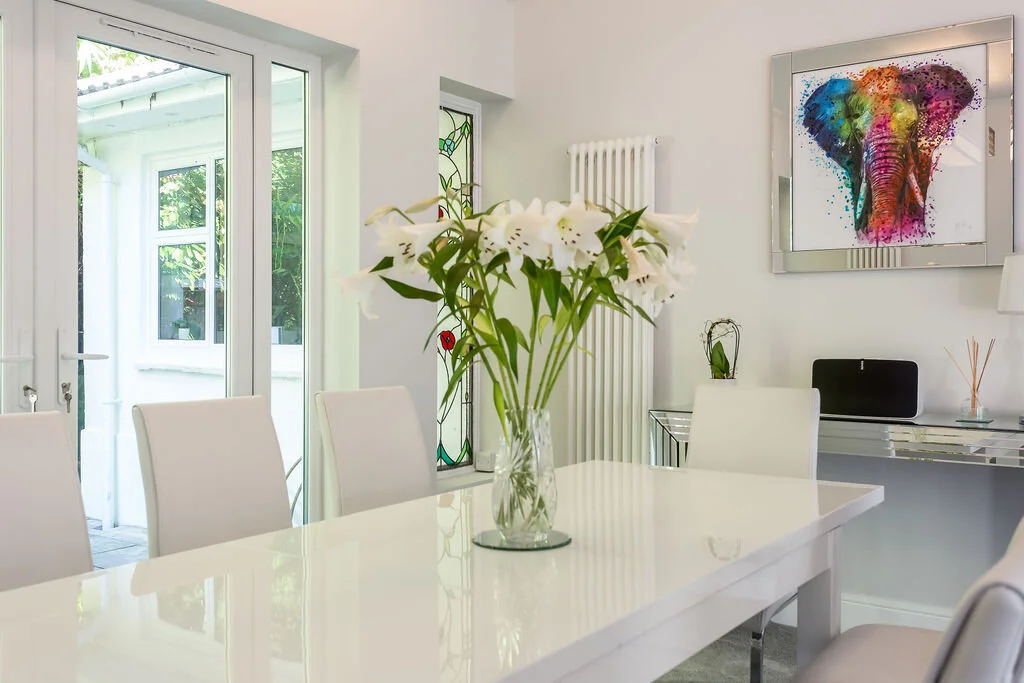 My lovely clients can now sit at their very own dining table with the doors we installed open onto the garden! 
