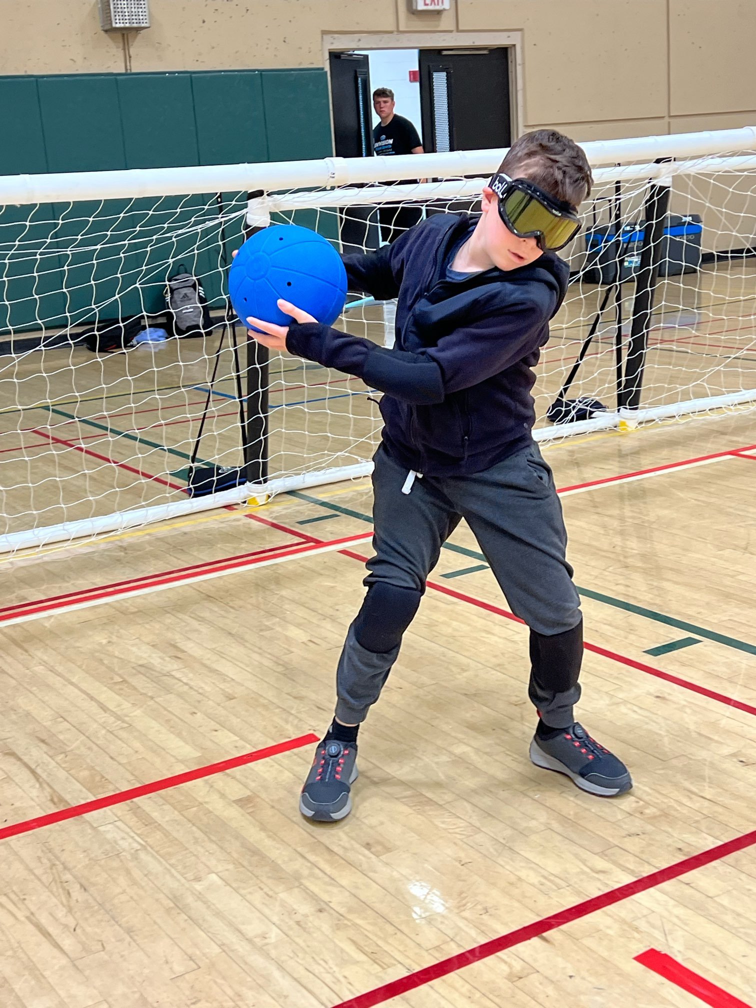  Lucas throwing a goalball during a game 