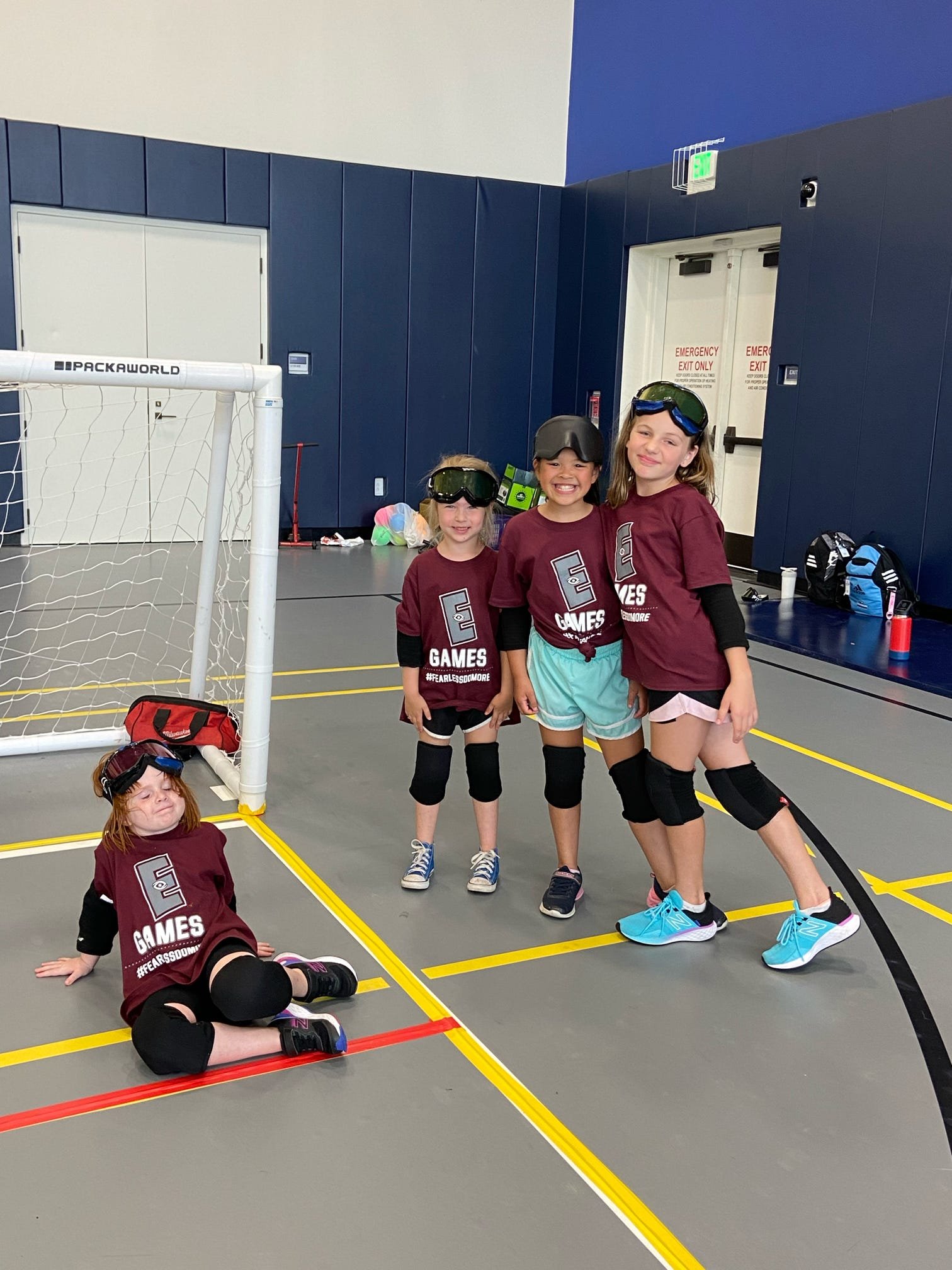  4 of our young athletes getting ready to play goalball 