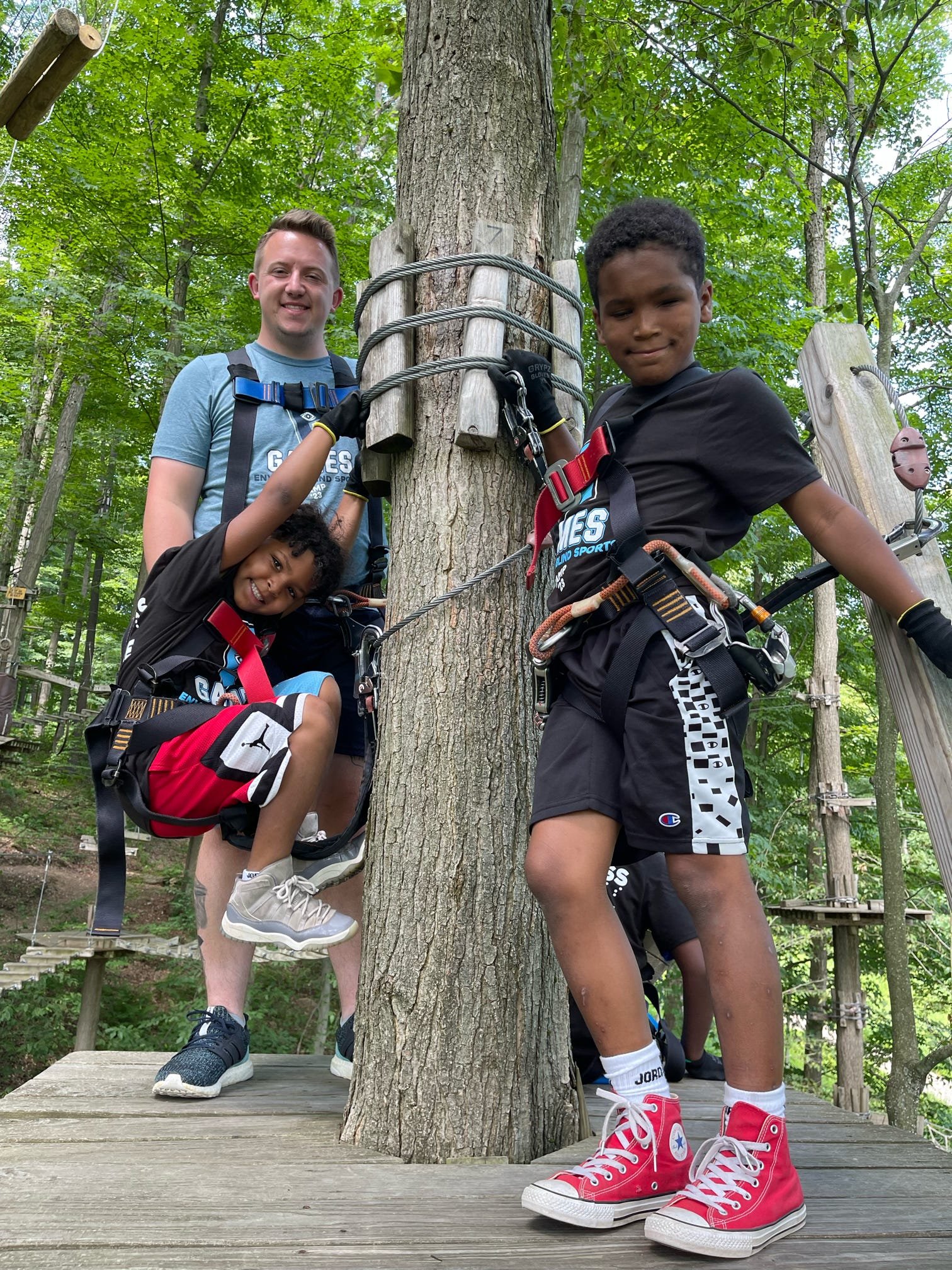  Zack, Kam, and Kai navigating the ropes course 