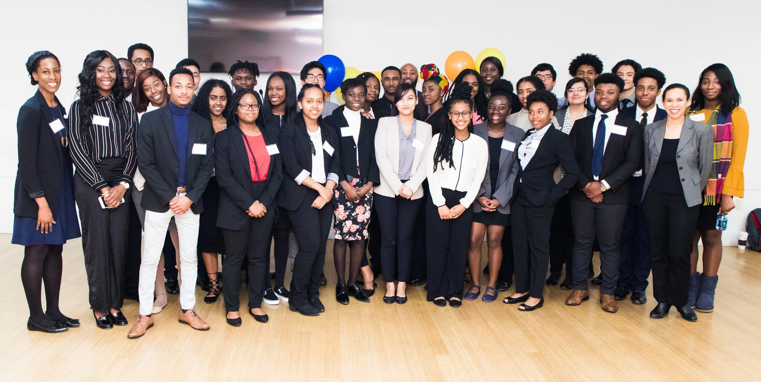 Anna Hargrave, Executive Director of the Community Foundation in Montgomery County, poses with Urban Alliance Scholars.