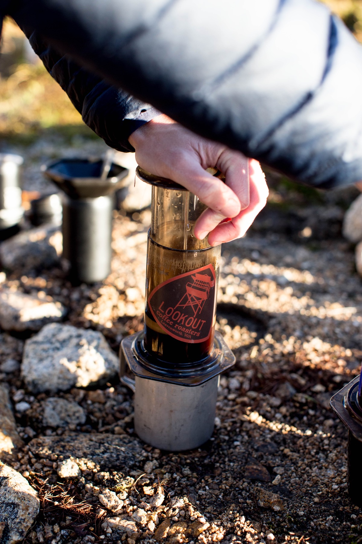 An Aeropress is an easy and portable device to use while backpacking and camping. 