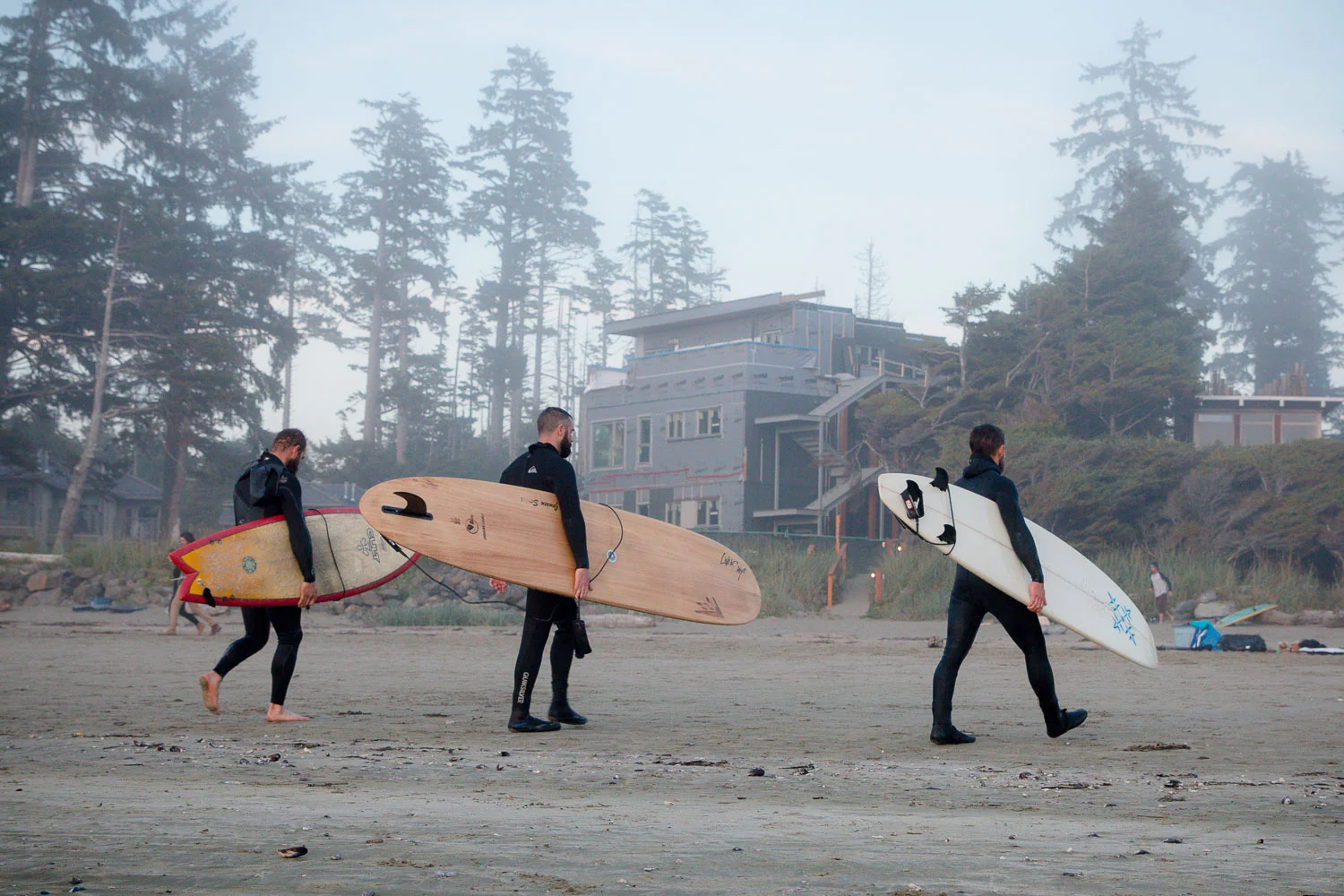 Black and white photo of a surfer at Cox Bay Beach in Tofino, Summer 2017 