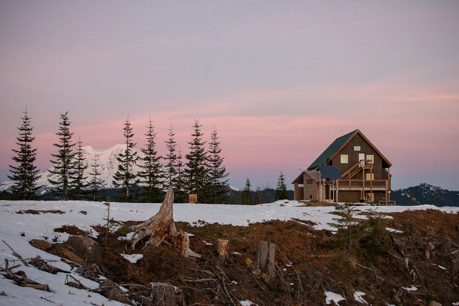 Bruni's Snow Bowl Hut and Mt. Rainer in the distance.