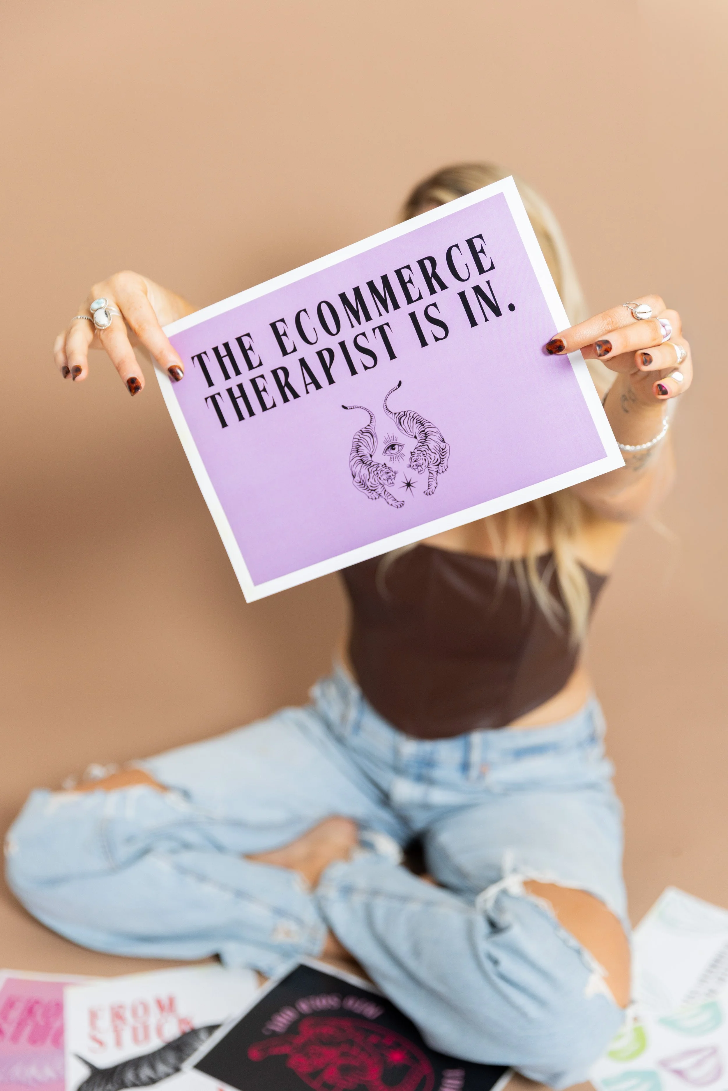  Elyse Collat personal branding shoot with a backdrop and printed out papers as props props  