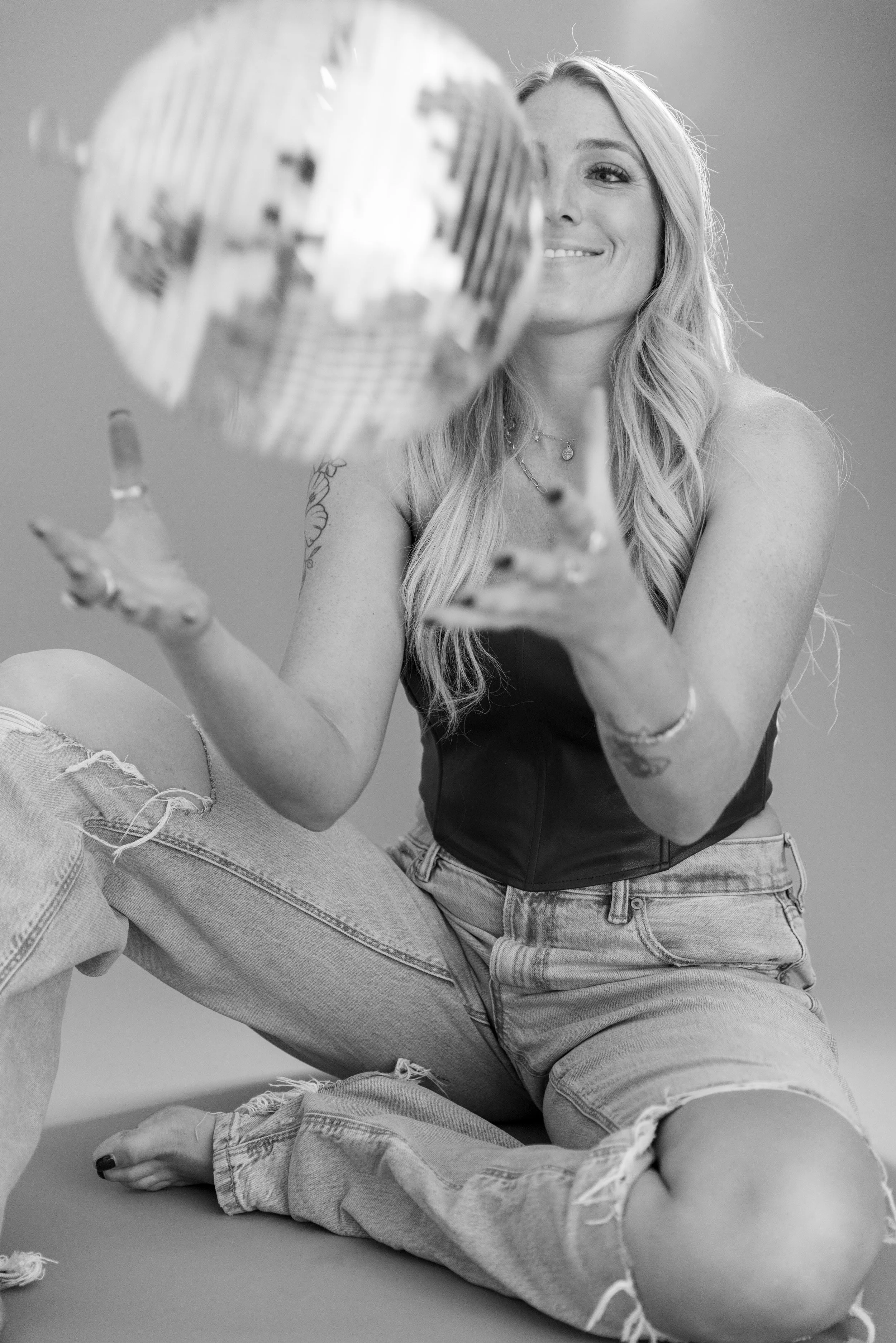  Elyse Collat with a disco ball prop in a Melbourne studio personal branding photoshoot 