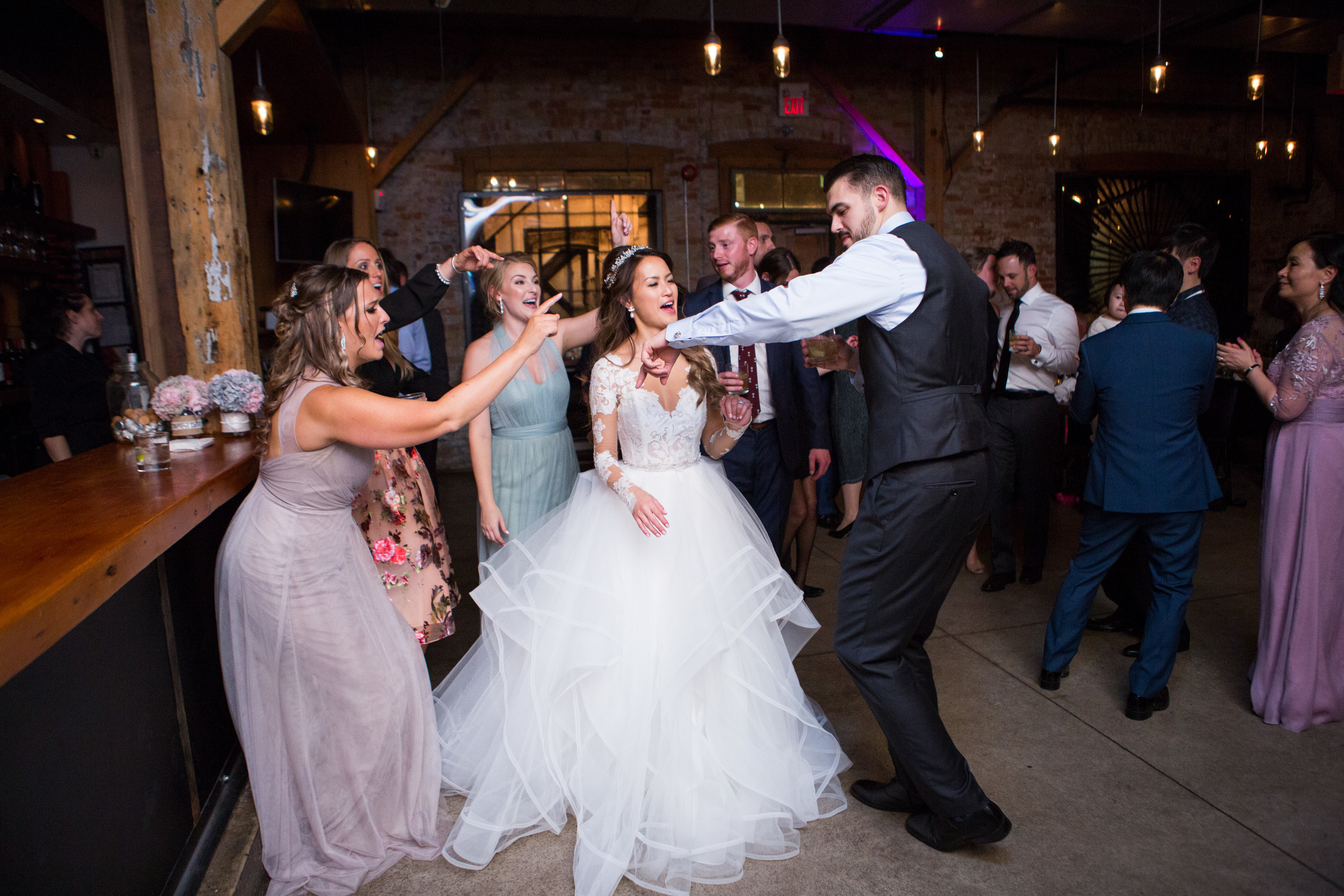 Wedding guests dancing at Archeo Distillery District Toronto