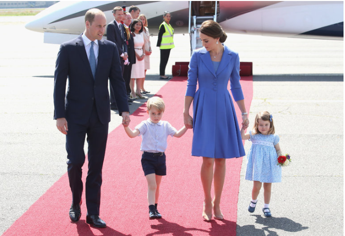 The Duke and Duchess of Cambridge (wearing a Catherine Walker look) with their children, Prince George and Princess Charlotte, on Wednesday as they arrived at Berlin Tegel Airport. CreditChris Jackson/Getty Images 