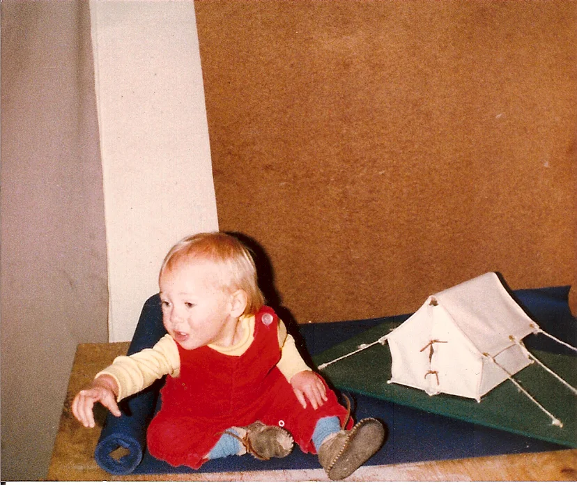 Tiny me in my dad's shop circa 1982, with a model tent. 