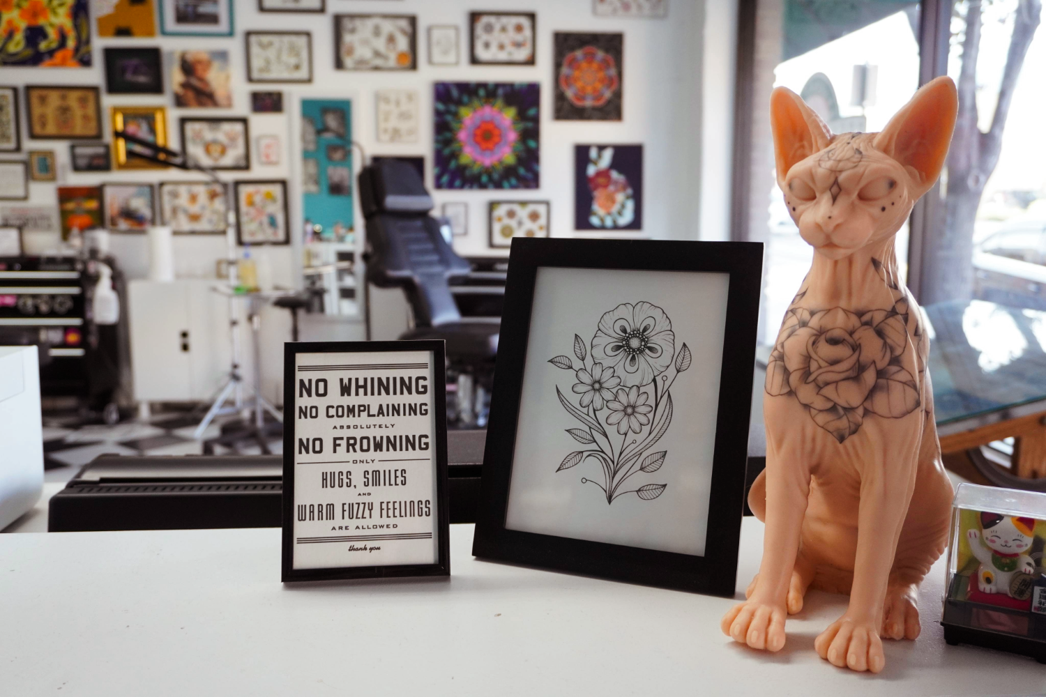 Image of artwork at the front reception desk at Roses and Rivets