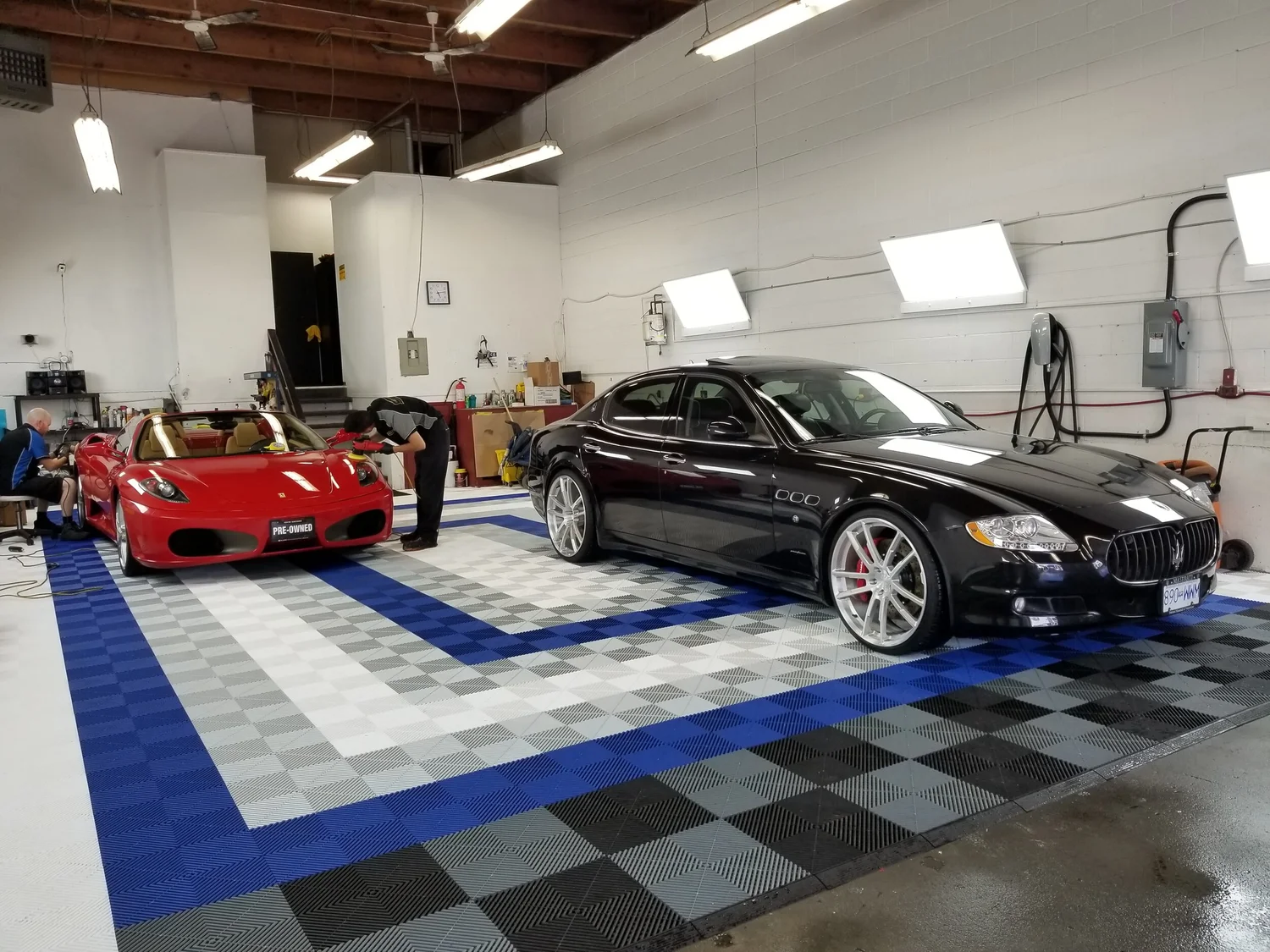 Detailer working at Tiago's Auto Spa