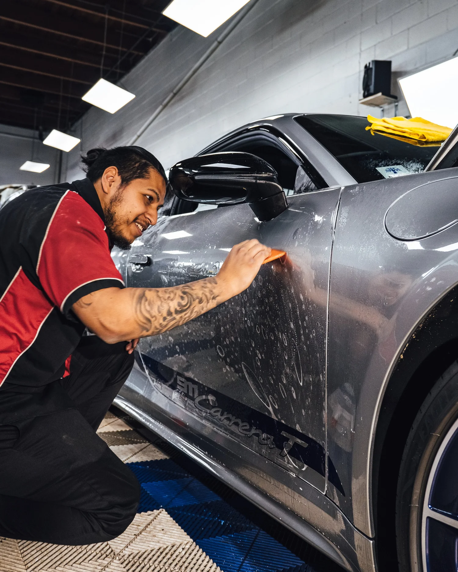 3. Apply paint protection film with slip solution. Heat edges to lock the film down.