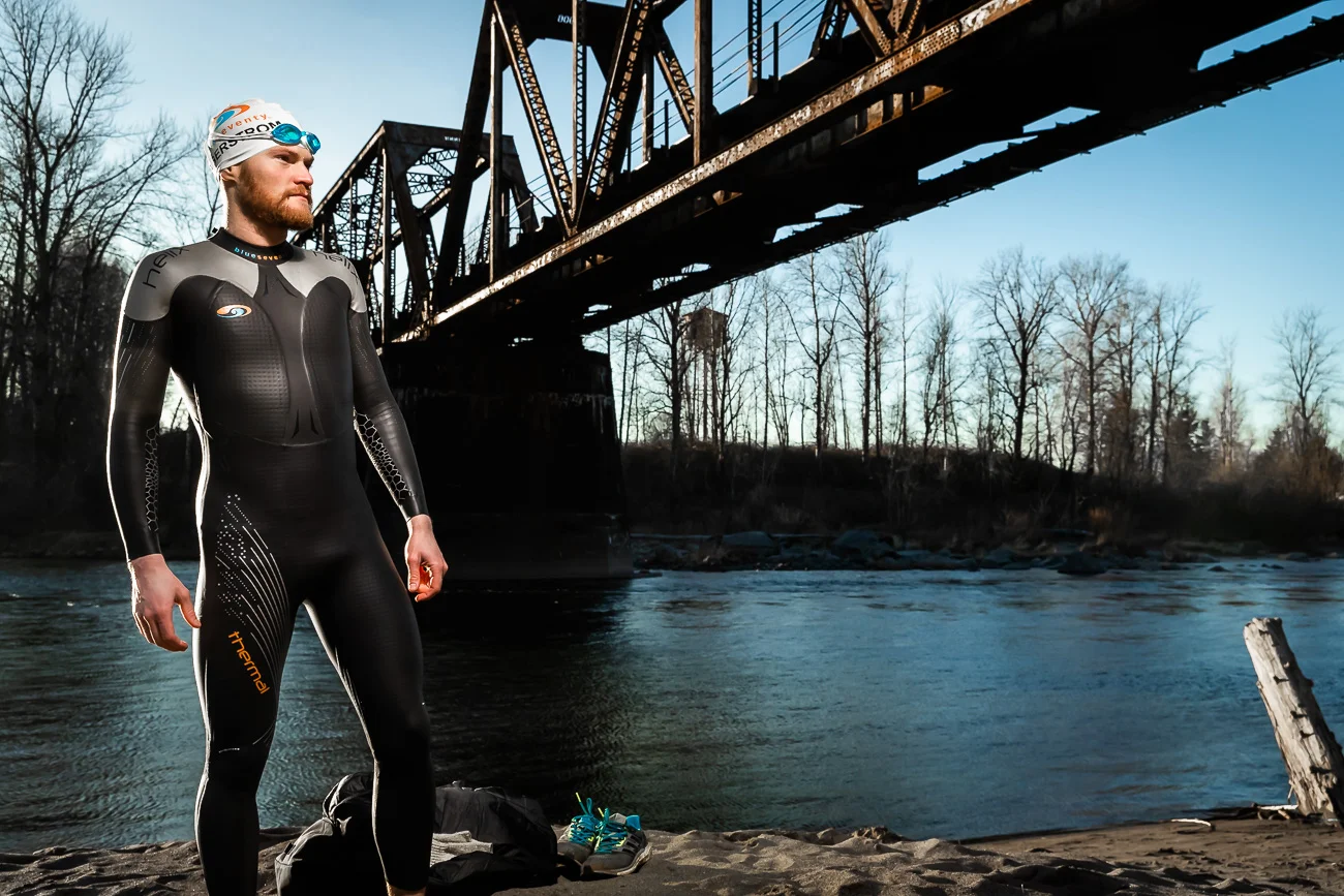 Eric Lagerstrom poses for a portrait showing off his Blue Seventy Thermal Wetsuit after Swimming the Sandy River just out side of Portland, Oregon in the middle of January.