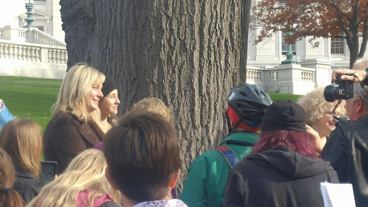 Masha, back left in black cap, joins the Solidarity Sing Along. Photo by Michael Penn II