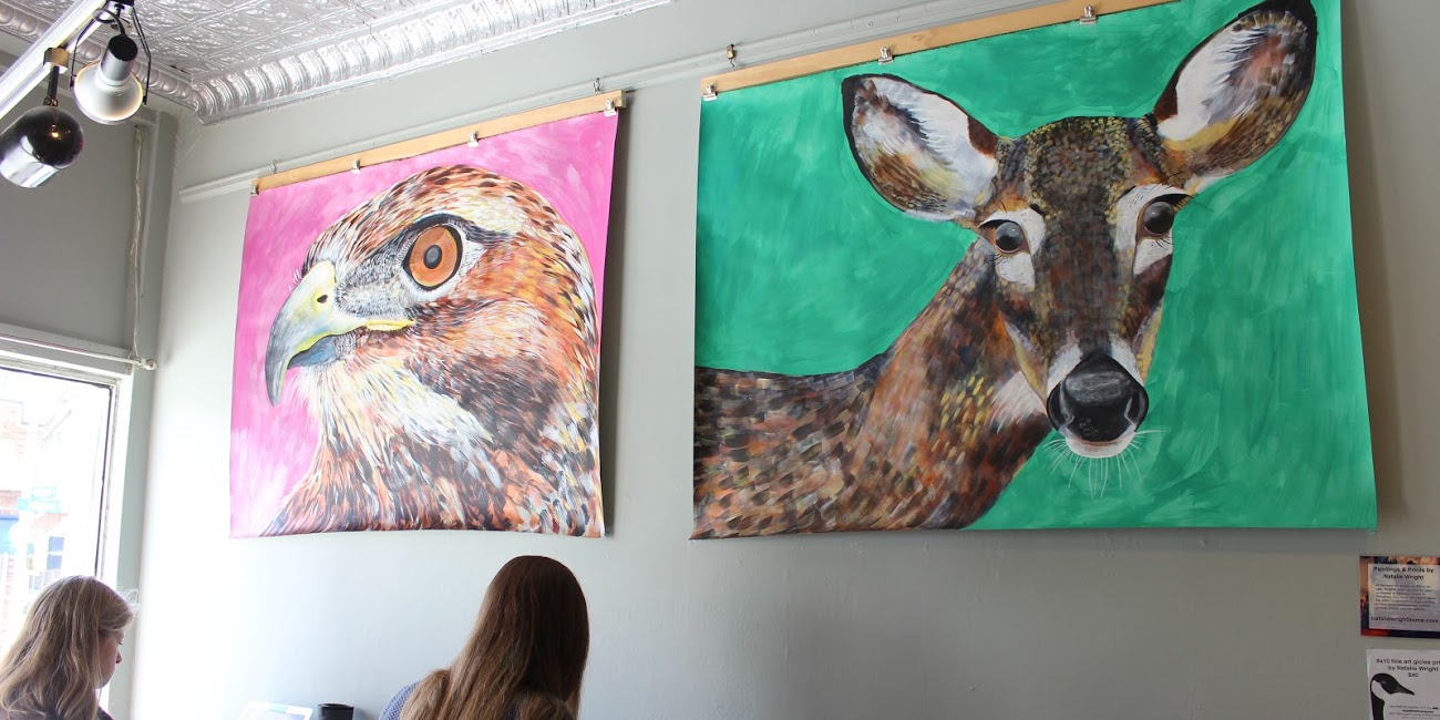 Natalie Wright's "Hawk" and "Deer Painting," currently on display at Johnson Public House. Photo by Sarah Witman.