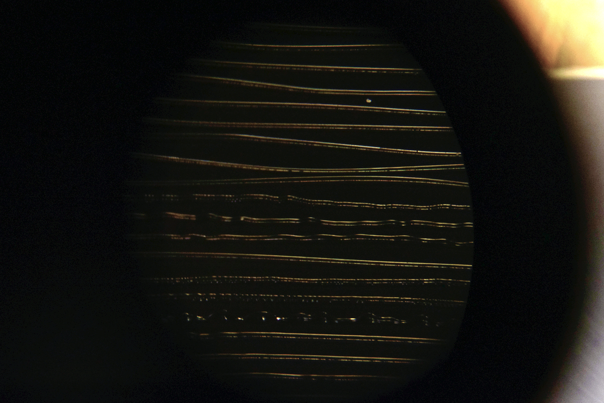 Grooves under a microscope, literally, in Amarrass Records' small-batch vinyl production facility near New Delhi.