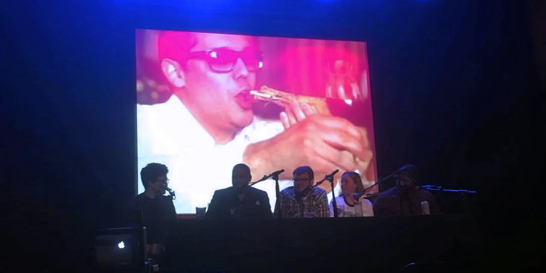 Our panel, dwarfed by an image of Andre Darlington indulging in bone luge . Photo by Daniella Echeverria.