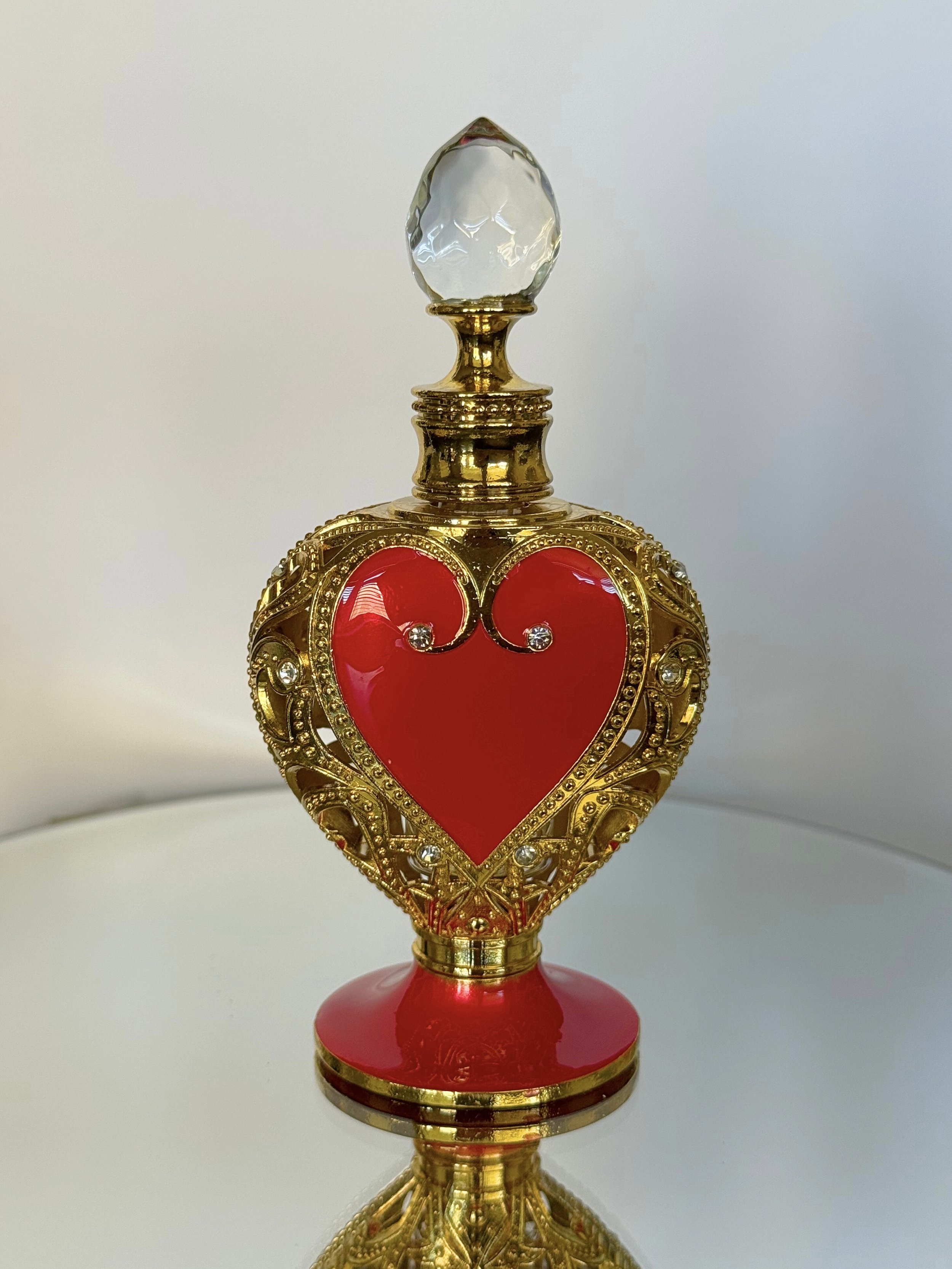 red heart shaped bottle.jpeg