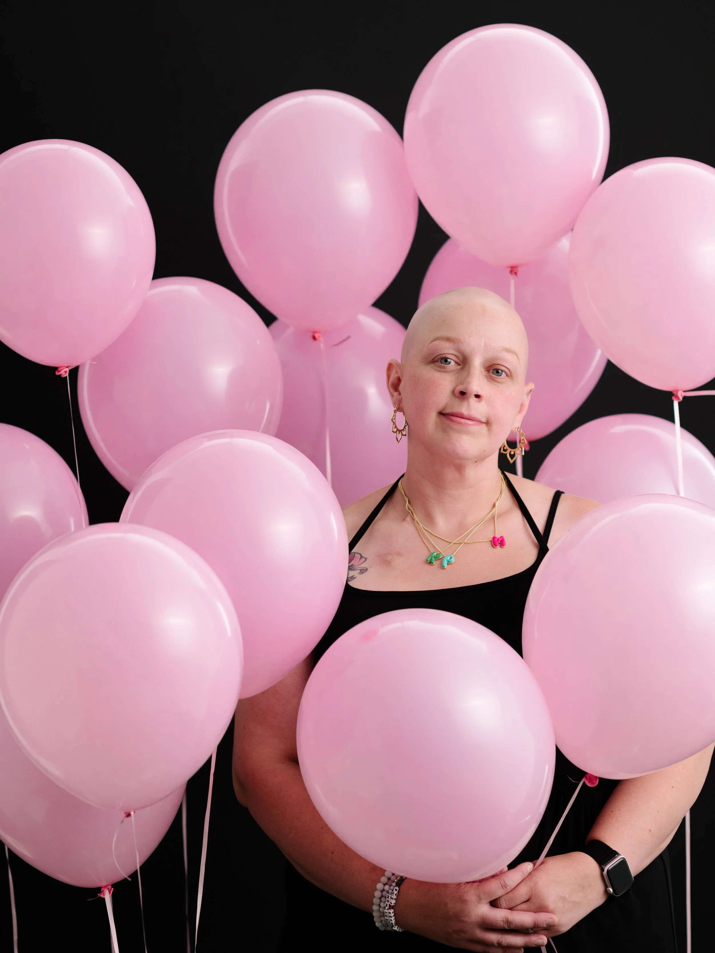 UNDER 40 is a photographic series centering individuals who have received a breast cancer diagnosis before the age of 40-the age at which the USPSTF currently recommends beginning routine screening for breast cancer. The number of pink balloons repre