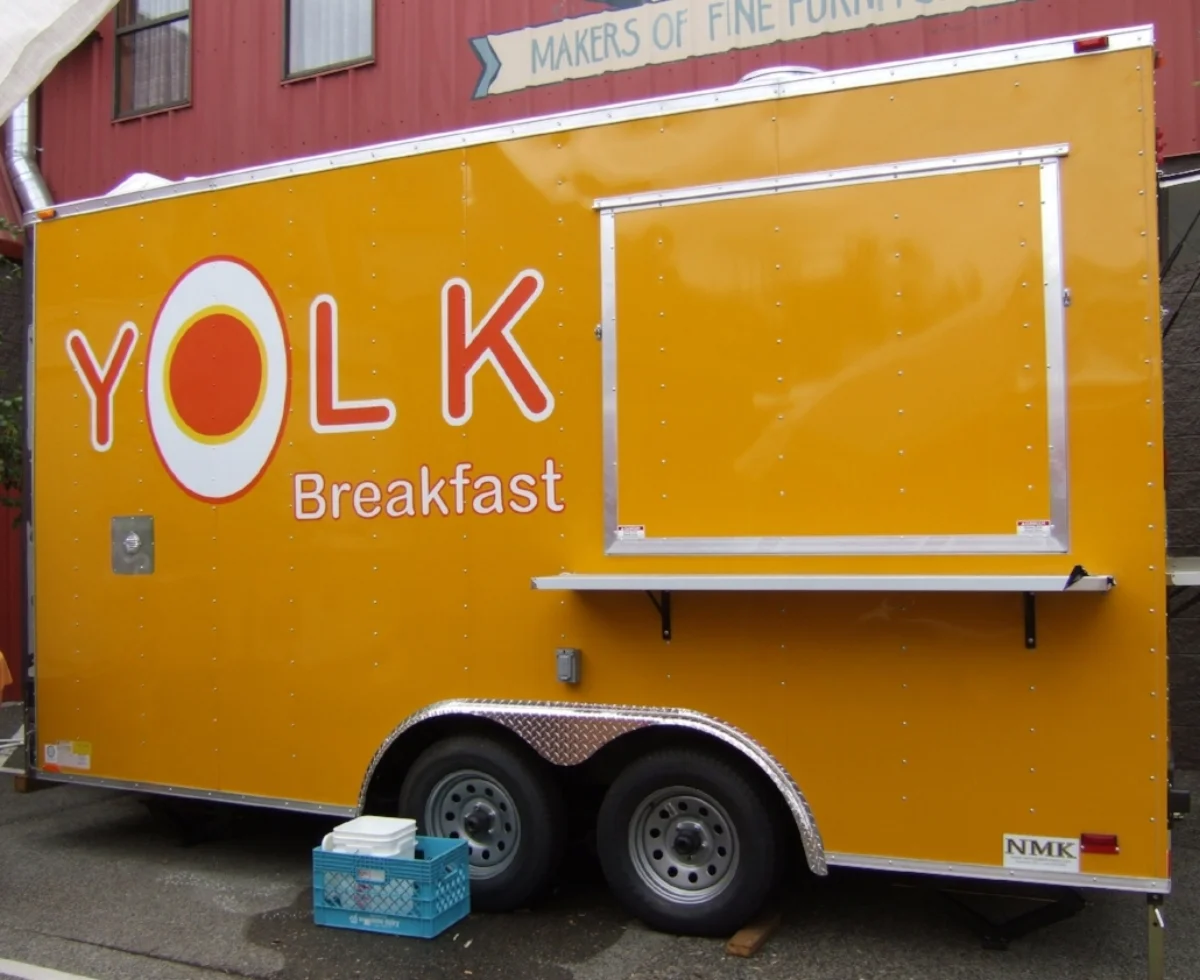Logo designed and painted for Yolk breakfast food cart