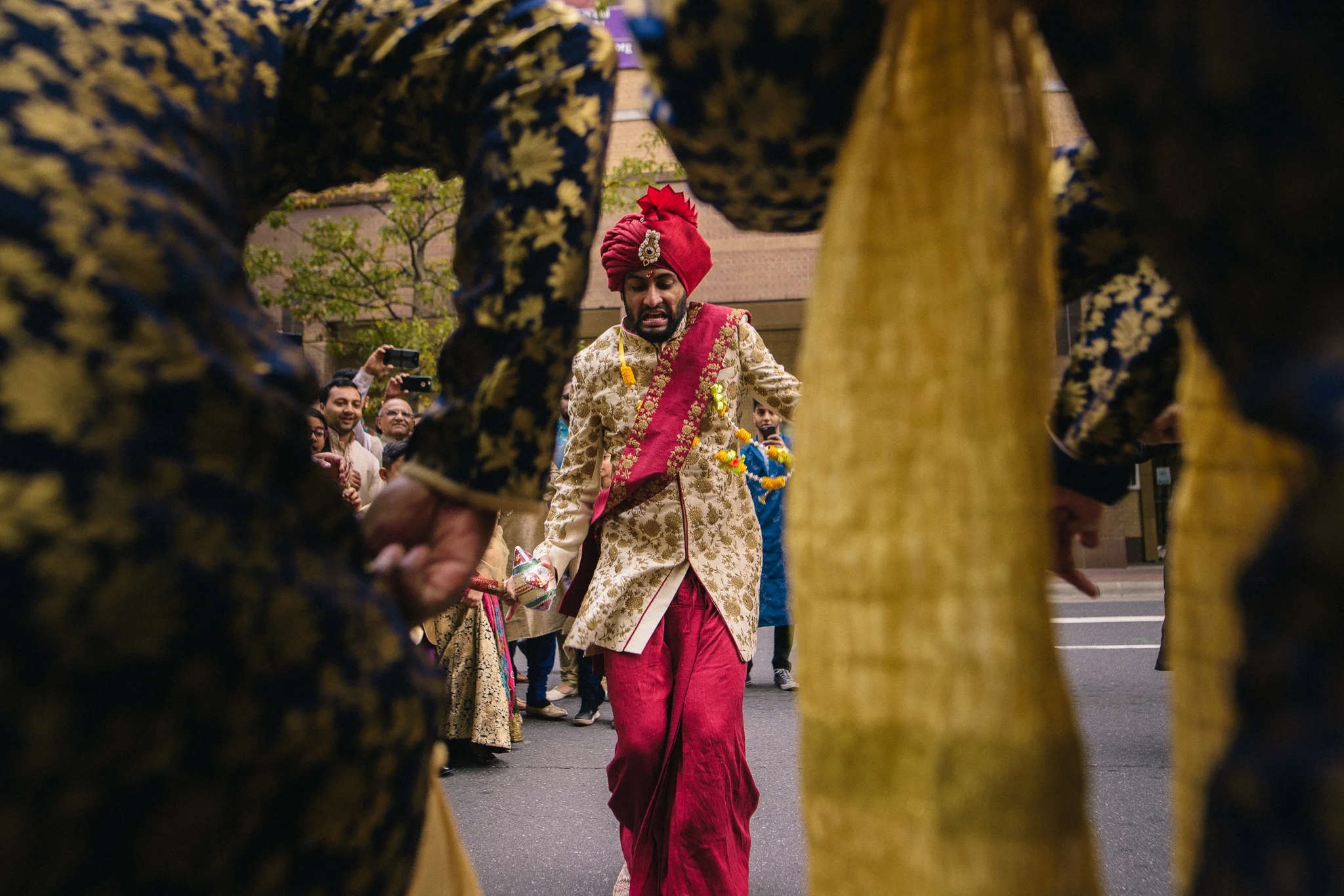 indian wedding groom dances during baraat outside the ritz carlton in charlotte NC