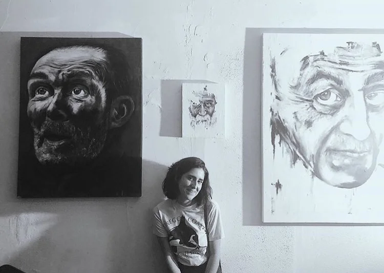 Artist Alexandra Suarez with her paintings at the Art+Music Winter Showcase - March 2018
