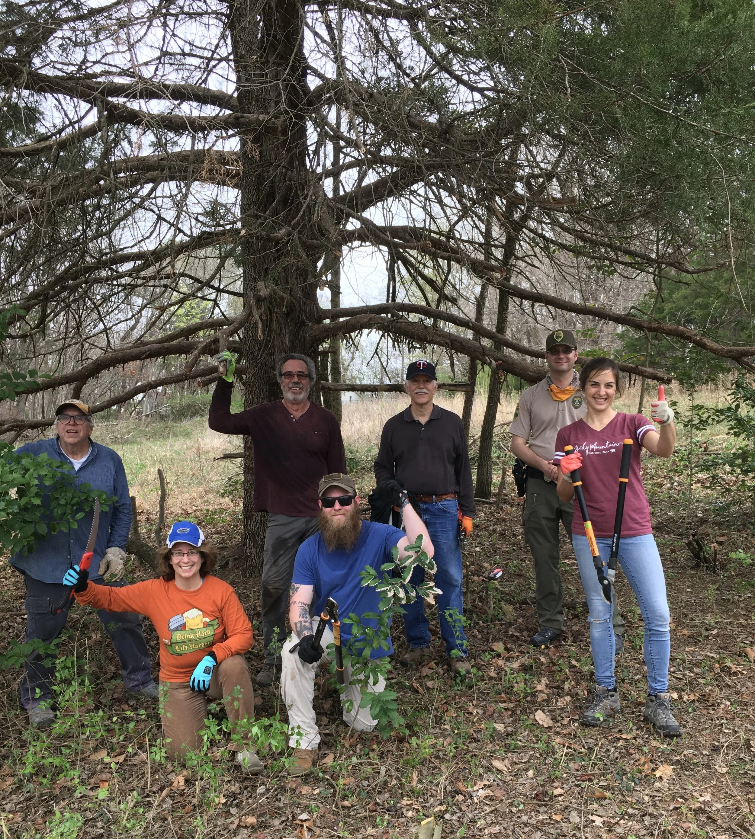 Vols wrangling weeds under tree.JPG
