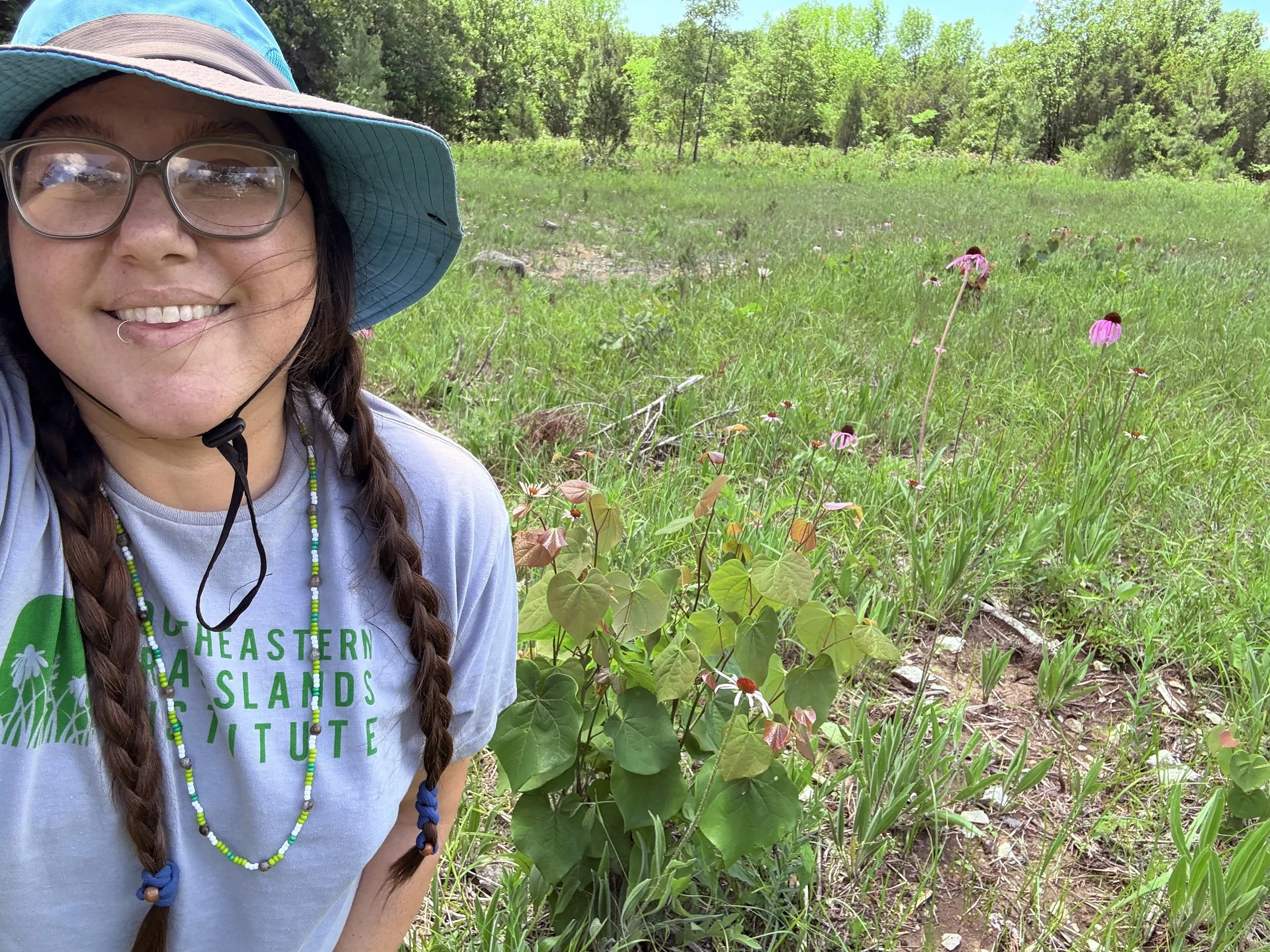 Katie in hat in front of prairie.jpeg