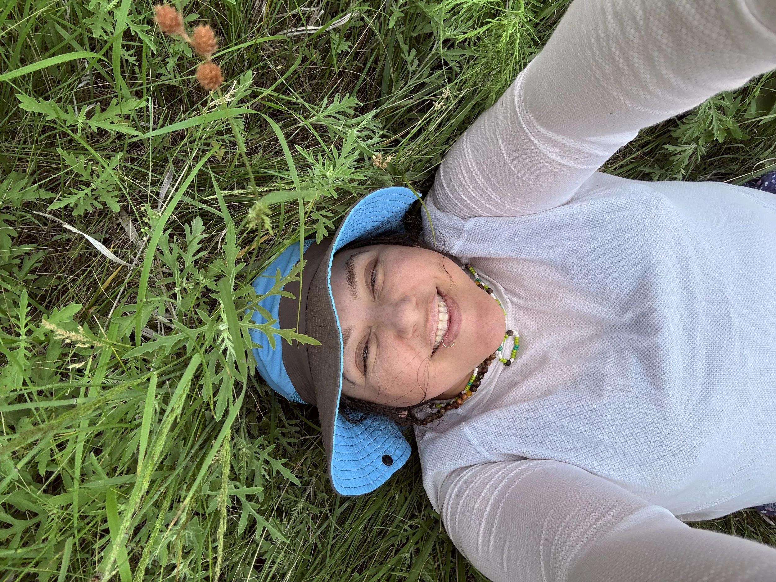 Katie_laying in grassland.jpeg