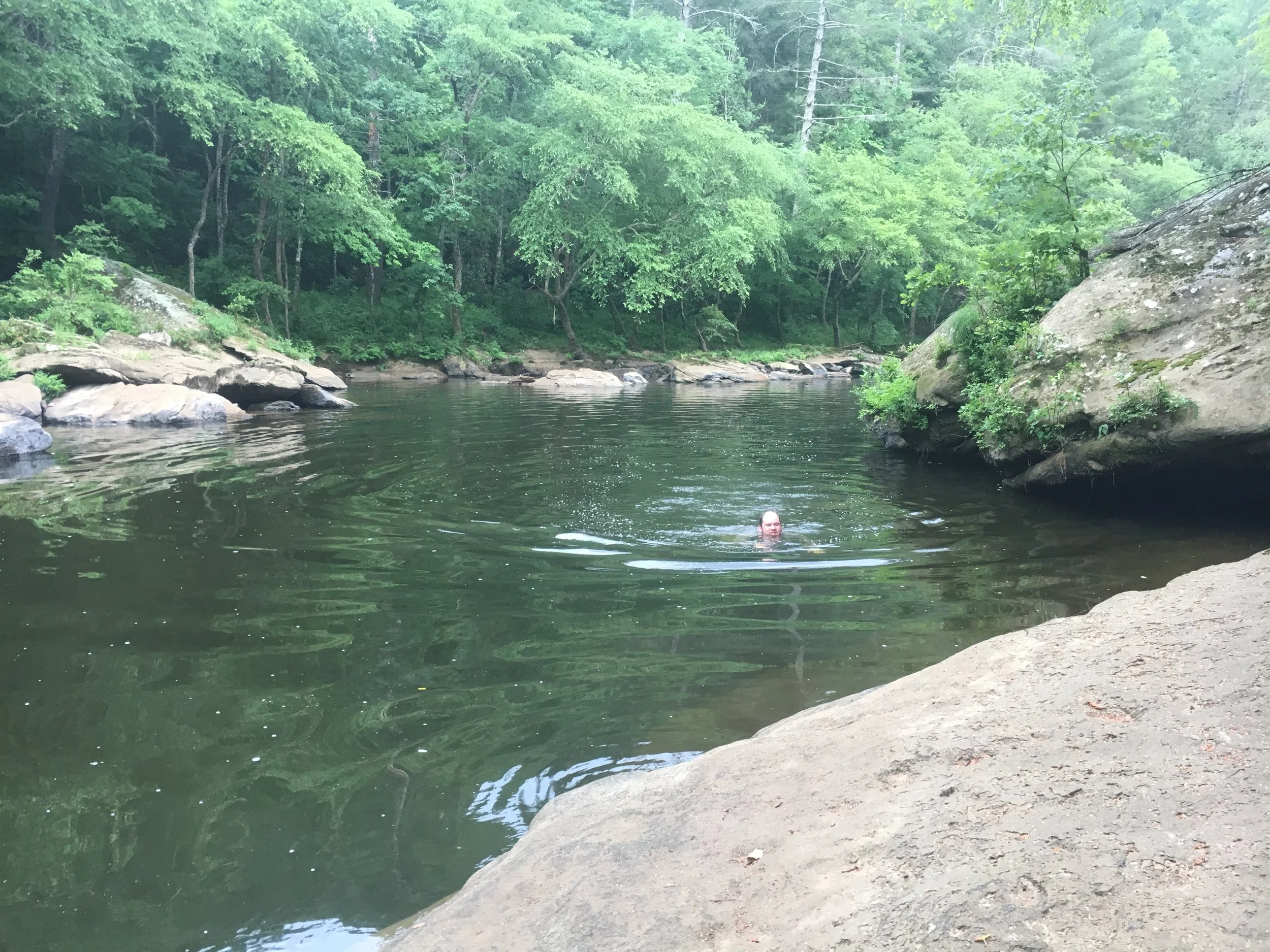  SGI’s Southern Appalachian Grassland Coordinator Zach Irick cooling off while traversing the narrow gorge of the Clear Fork River during riverscour surveys of the Big South Fork National River and Recreation Area in Tennessee. Portions of the gorge 